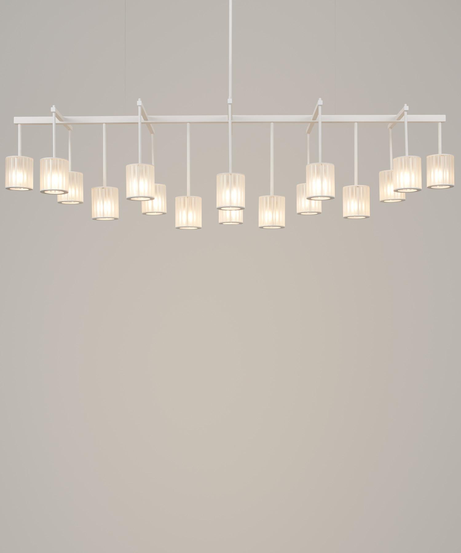 The largest member of the Flute family, the Flute Beam Chandelier is available in two standard sizes and is perfectly suited to formal dining areas and living spaces. The textured powder coat or rich, brushed-brass finish can be combined with the
