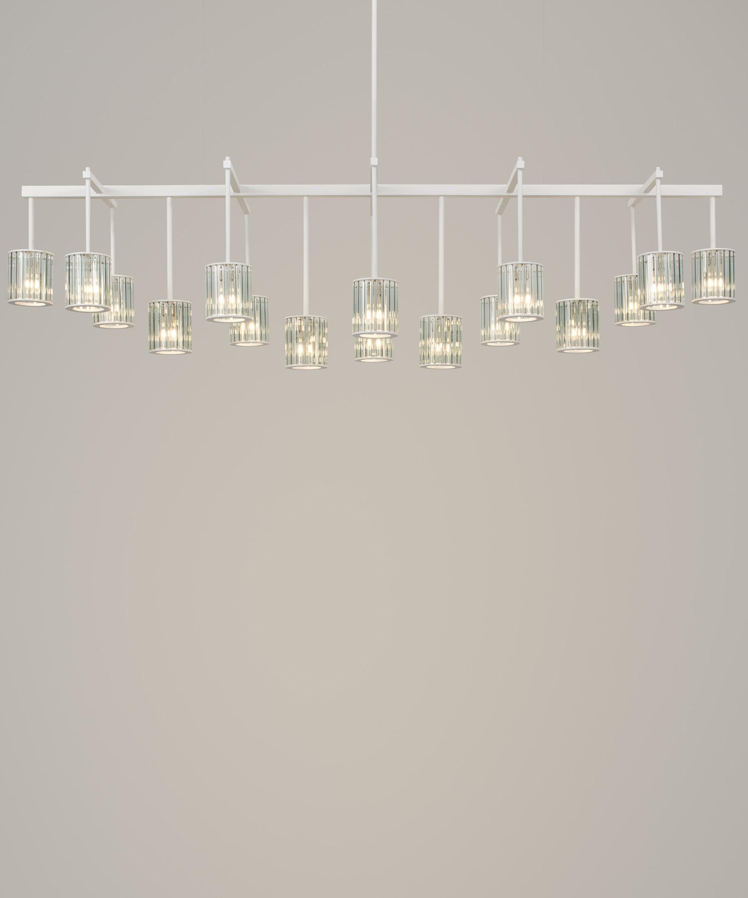 The largest member of the Flute family, the Flute Beam Chandelier is available in two standard sizes and is perfectly suited to formal dining areas and living spaces. The textured powder coat or rich, brushed-brass finish can be combined with the