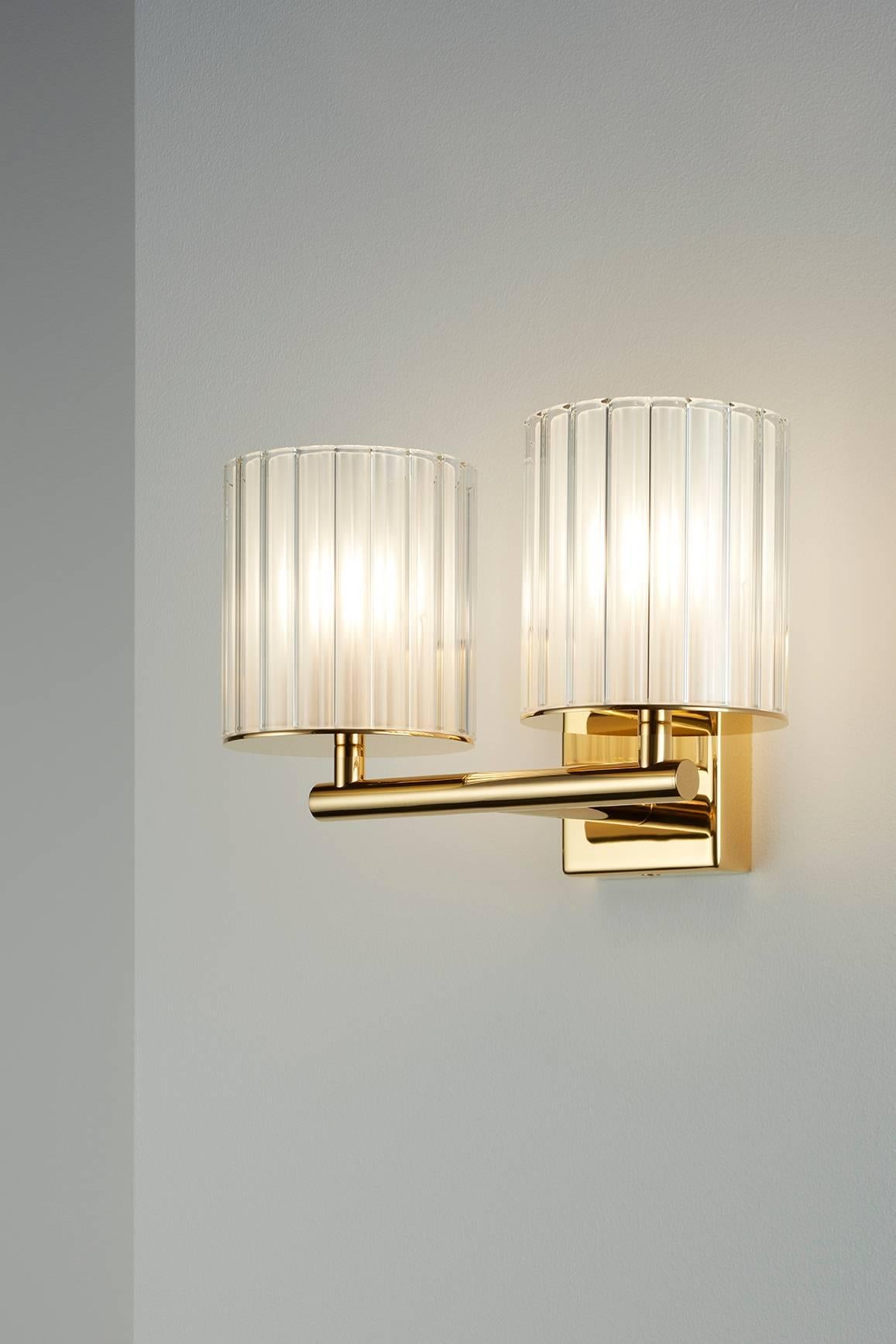 Designed by Tom Kirk, the Flute Wall Light Double extends the functions of its single counterpart, increasing your options as well as delivering twice the light output. The fixture is available in a range of popular finishes including polished gold,