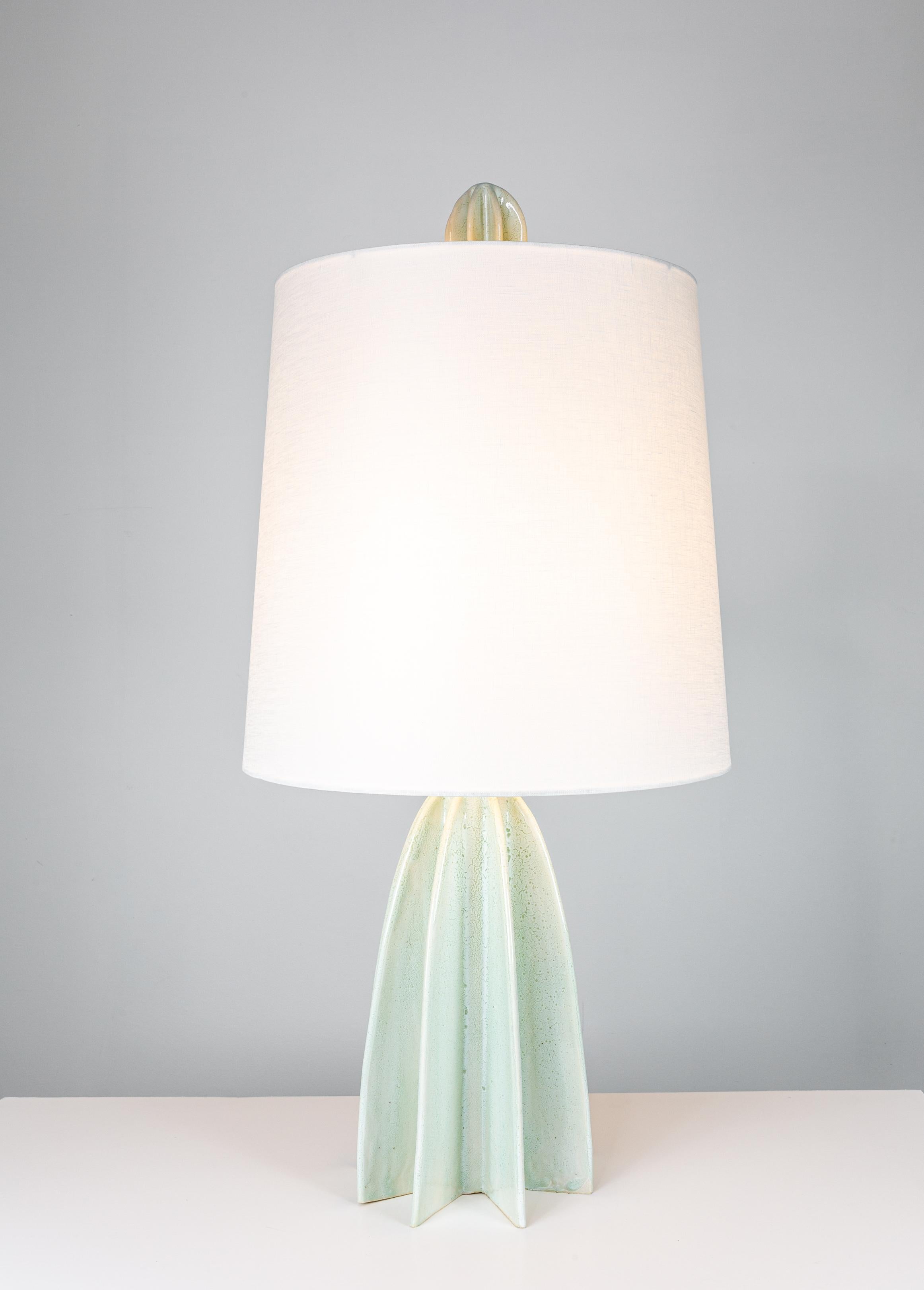 FLUTE_narrow Glacier White

To achieve the dept of the glaze, we fire this particular piece twice. The result is a layered glaze that evokes the quiet majesty of a glacier. Primarily a soft, translucent white, it carries a shade of pale blue that