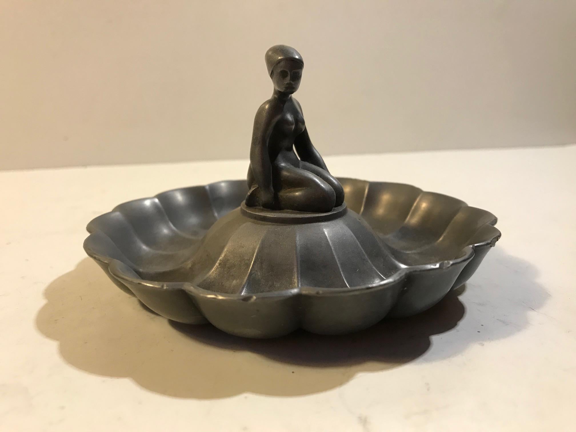 Small figural dish or ashtray by Just Andersen. Made from patinated pewter. Imprinted Just beneath its base.