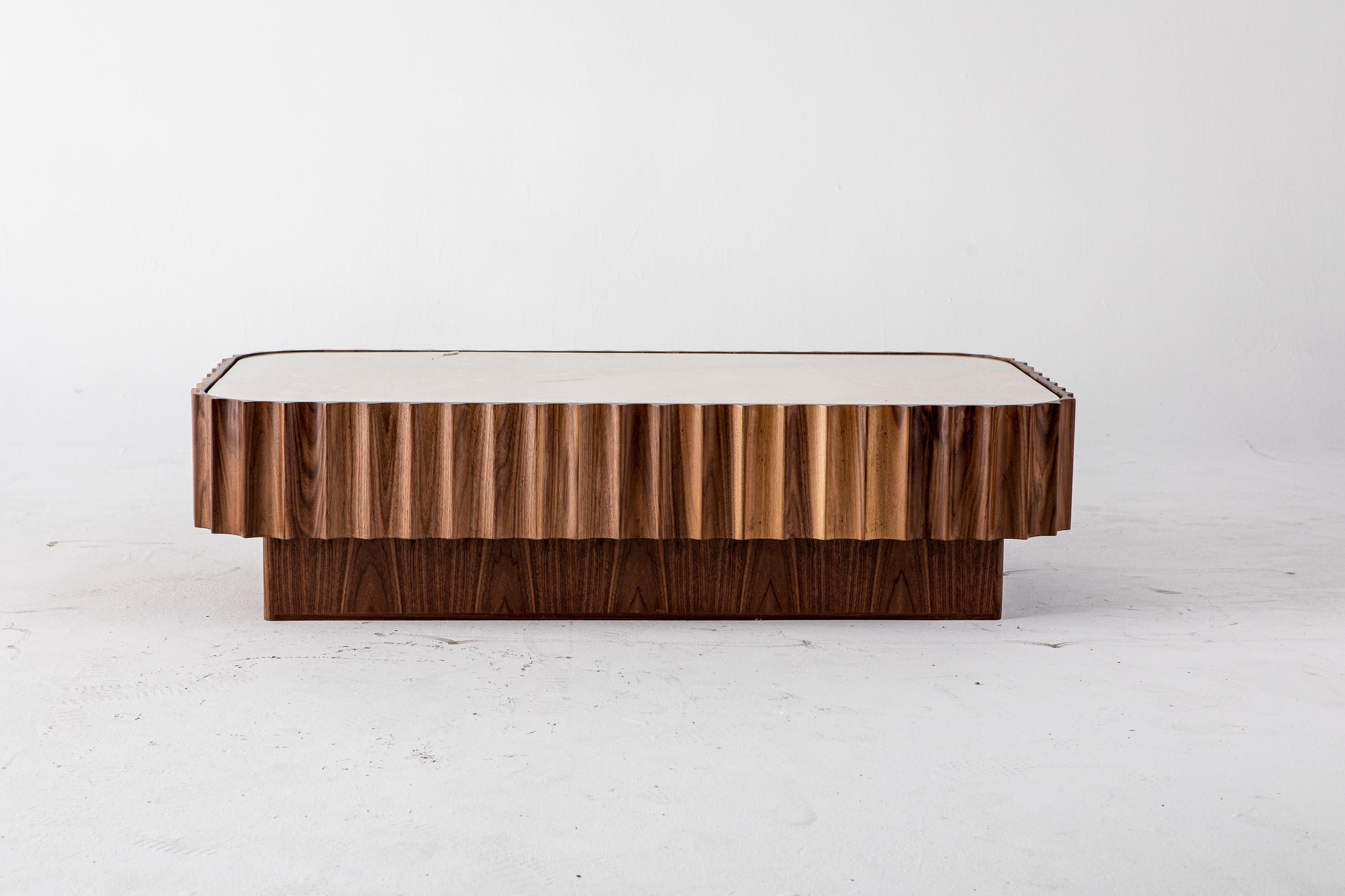 Fluted coffee table by Egg Designs
Dimensions: 140 L X 70 D X 32 H cm
Materials: African Mahogany, Travetine

Founded by South Africans and life partners, Greg and Roche Dry - Egg is a unique perspective in contemporary furniture inspired with a