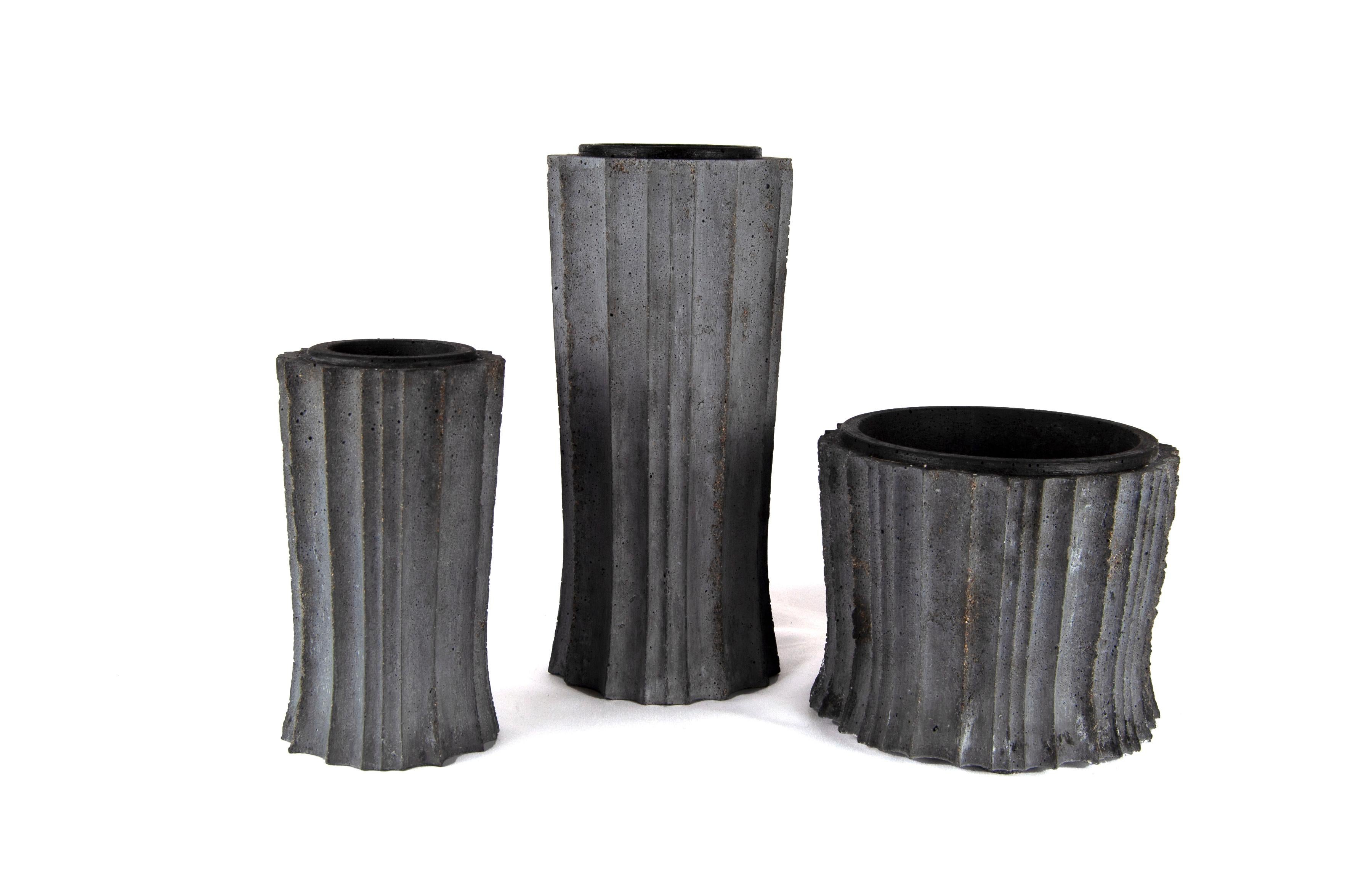 A little Art Deco, a little Gothic, very Brutal. Cast concrete, tinted with dark gray pigment. Natural finish. 

These vessels are great empty, but even better with flowers or a succulent planting. 

Small batches, with limited quantities available.