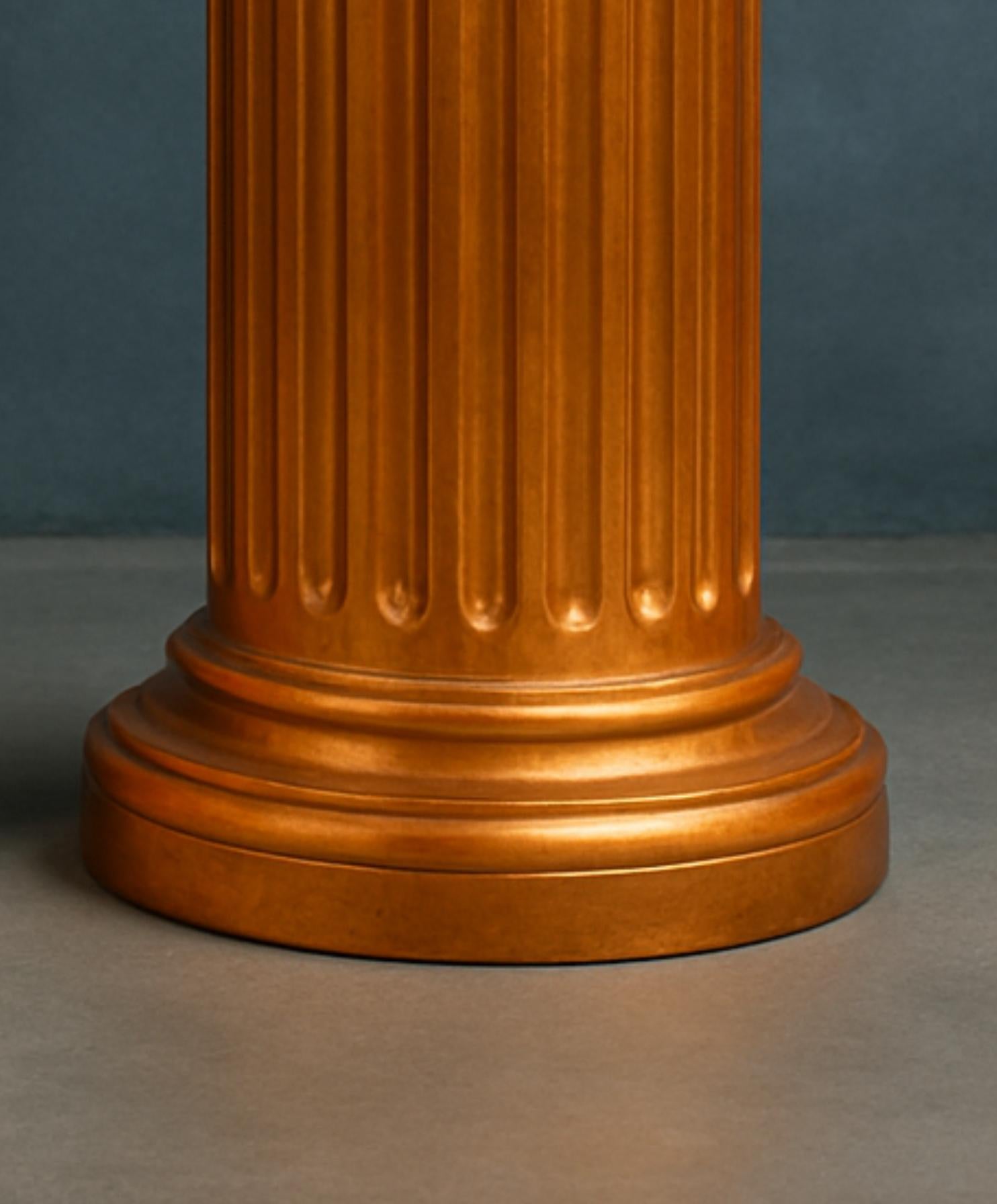 This elegant 19th-century French copper gilt golden column showcases the Louis Philippe style. 
The fluted details and horizontal cornice evoke a classic, timeless aesthetic, while the Doric-inspired design adds structural elegance to the