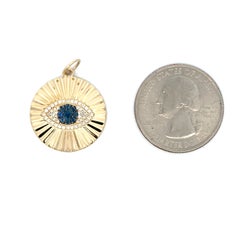 Pendentif or jaune 14 carats diamant saphir oeil du mal 2.2 grammes