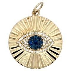 Pendentif or jaune 14 carats diamant saphir oeil du mal 2.2 grammes