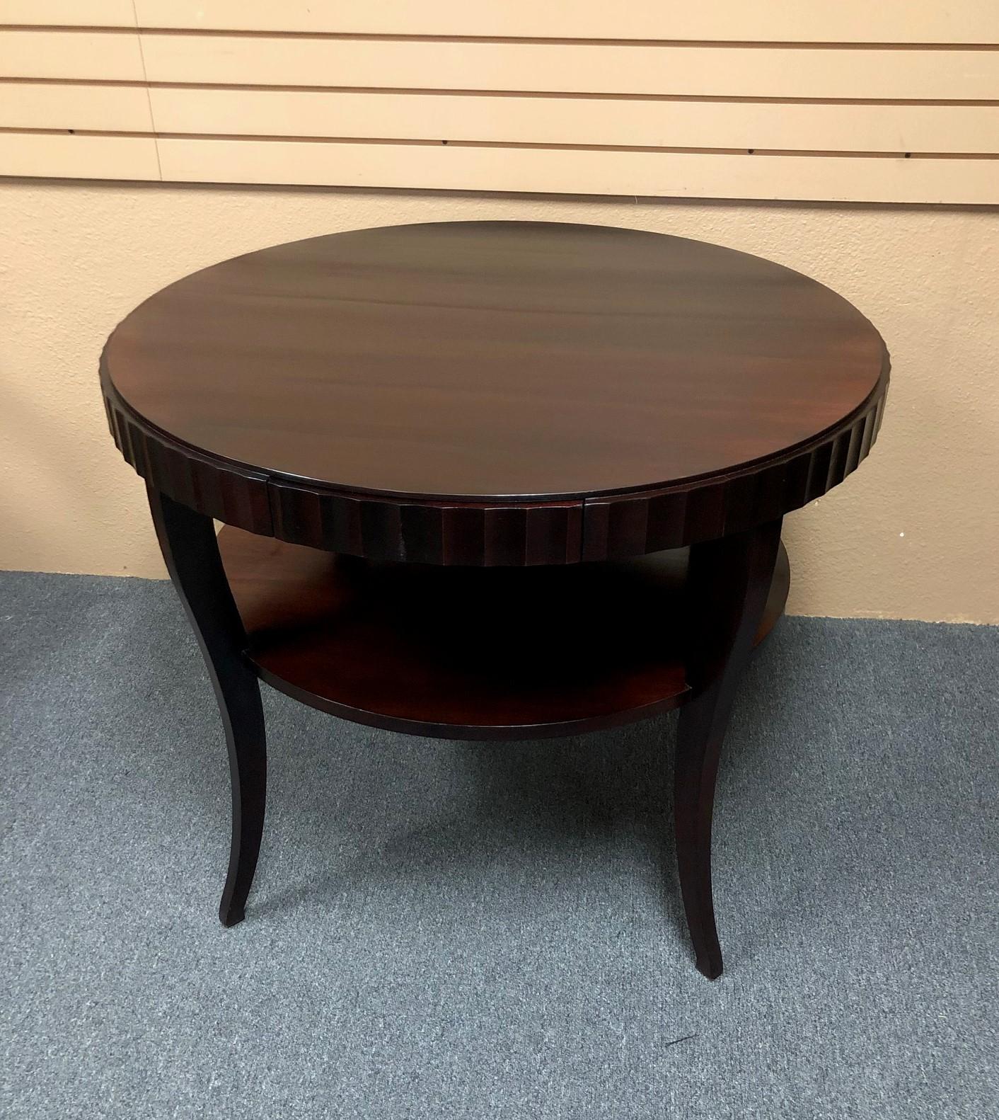 Gorgeous fluted edge round entry table by Barbara Barry for Baker. The table has a java mahogany finish and has been professionally refinished; it is in like new condition. The dimensions are 38