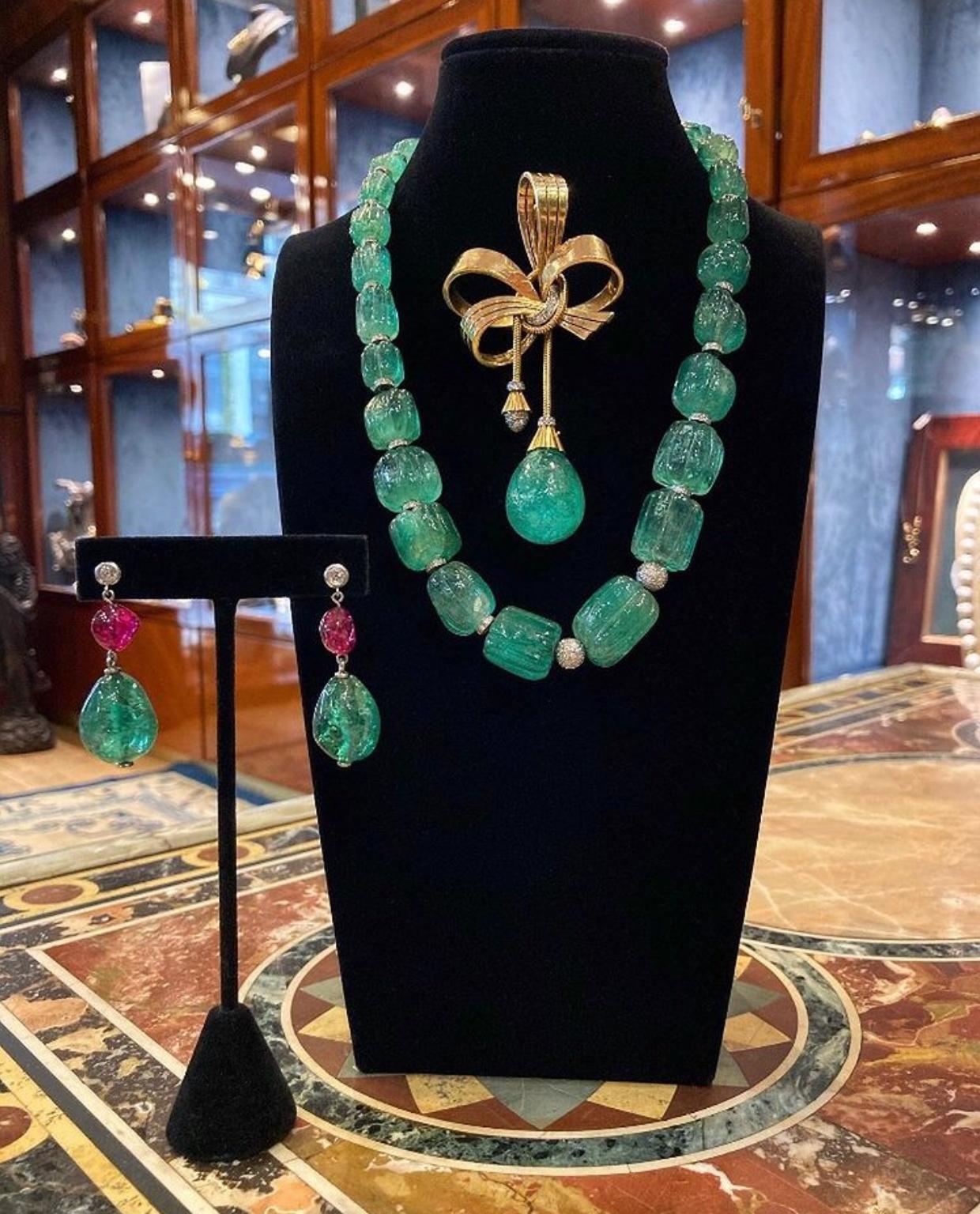 A mesmerizing necklace comprised of 470 carats of fluted Colombian emerald beads, and diamond spacers, accented by a Boucheron diamond and pearl clasp.