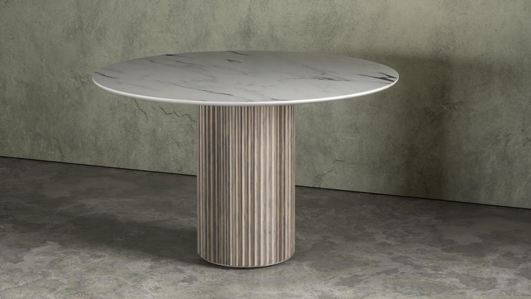 The Pilar Dining Table exudes a sense of subtle elegance and character in the space it inhabits. With a round top and fluted pedestal base, the table is sturdy without looking heavy. The table seats four comfortably and can be used in a breakfast