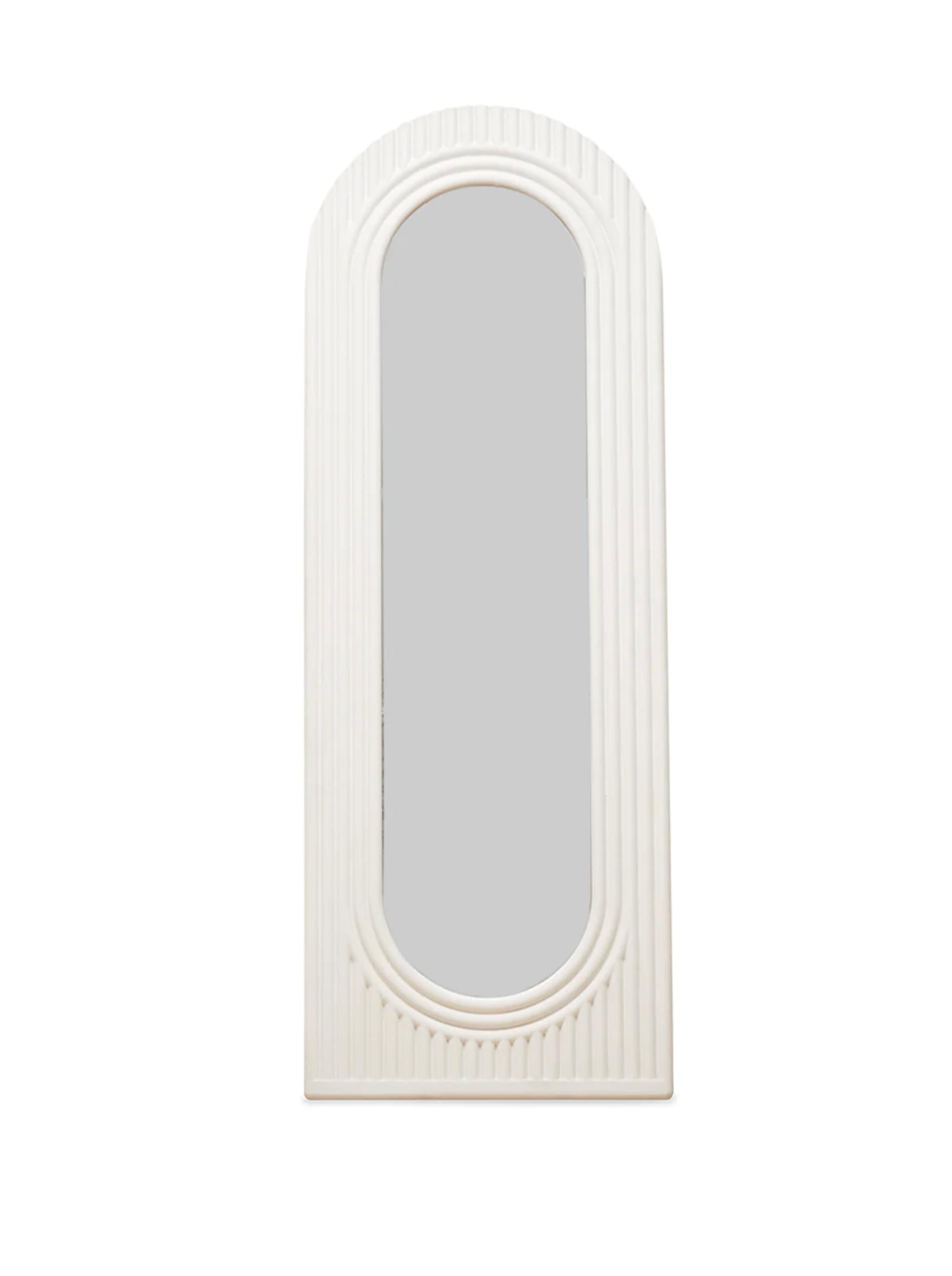 This minimalist hand-cast reinforced gypsum mirror is a top-quality Ian C.R. Martin Studio piece. It features a striking, concentric design using a backcasting method that integrates the mirror seamlessly into its plaster frame.  The plaster is