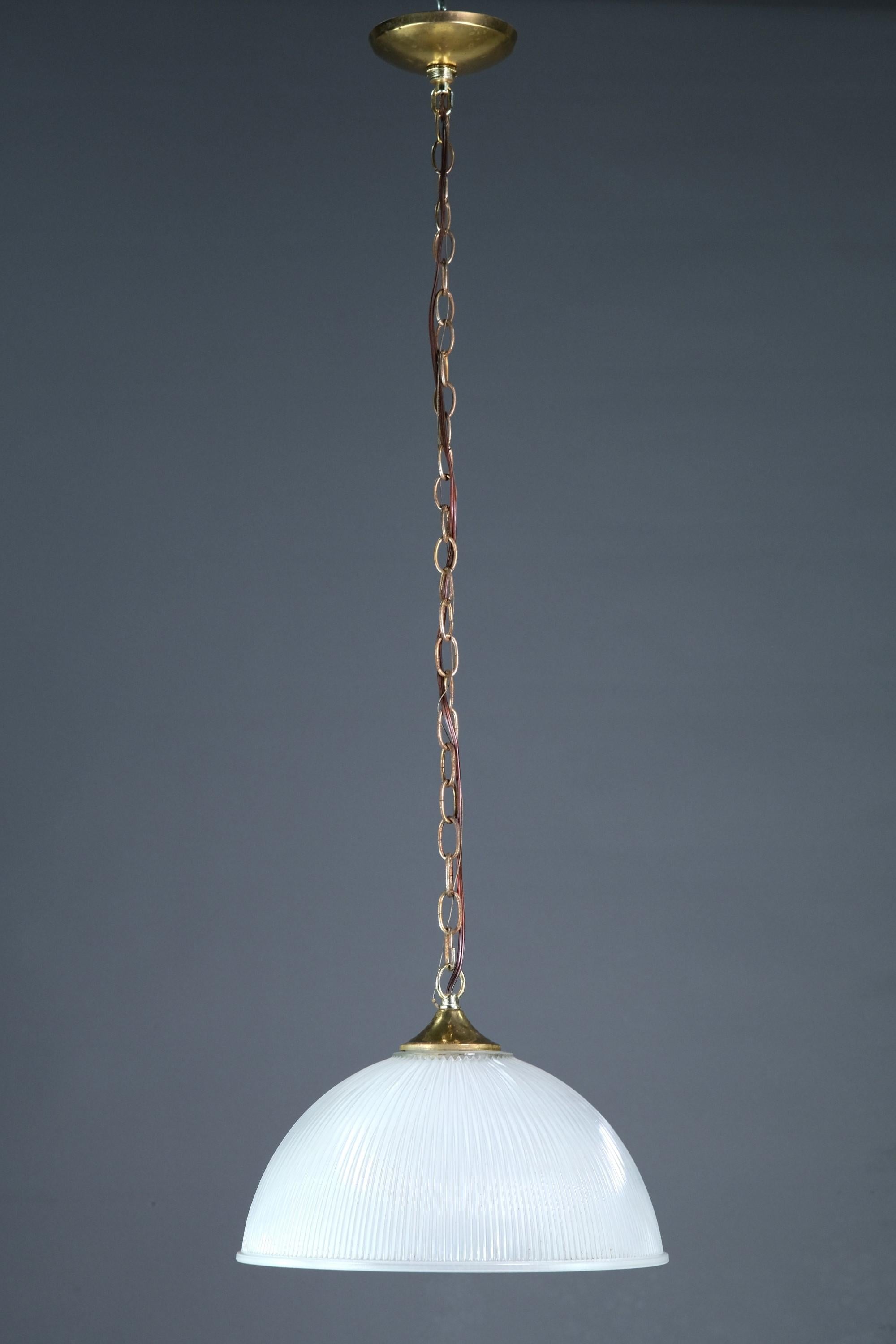 20th cntury half globe pendant light. Shade is both fluted and frosted. Brass hardware. This can be seen at our 400 Gilligan St location in Scranton, PA.