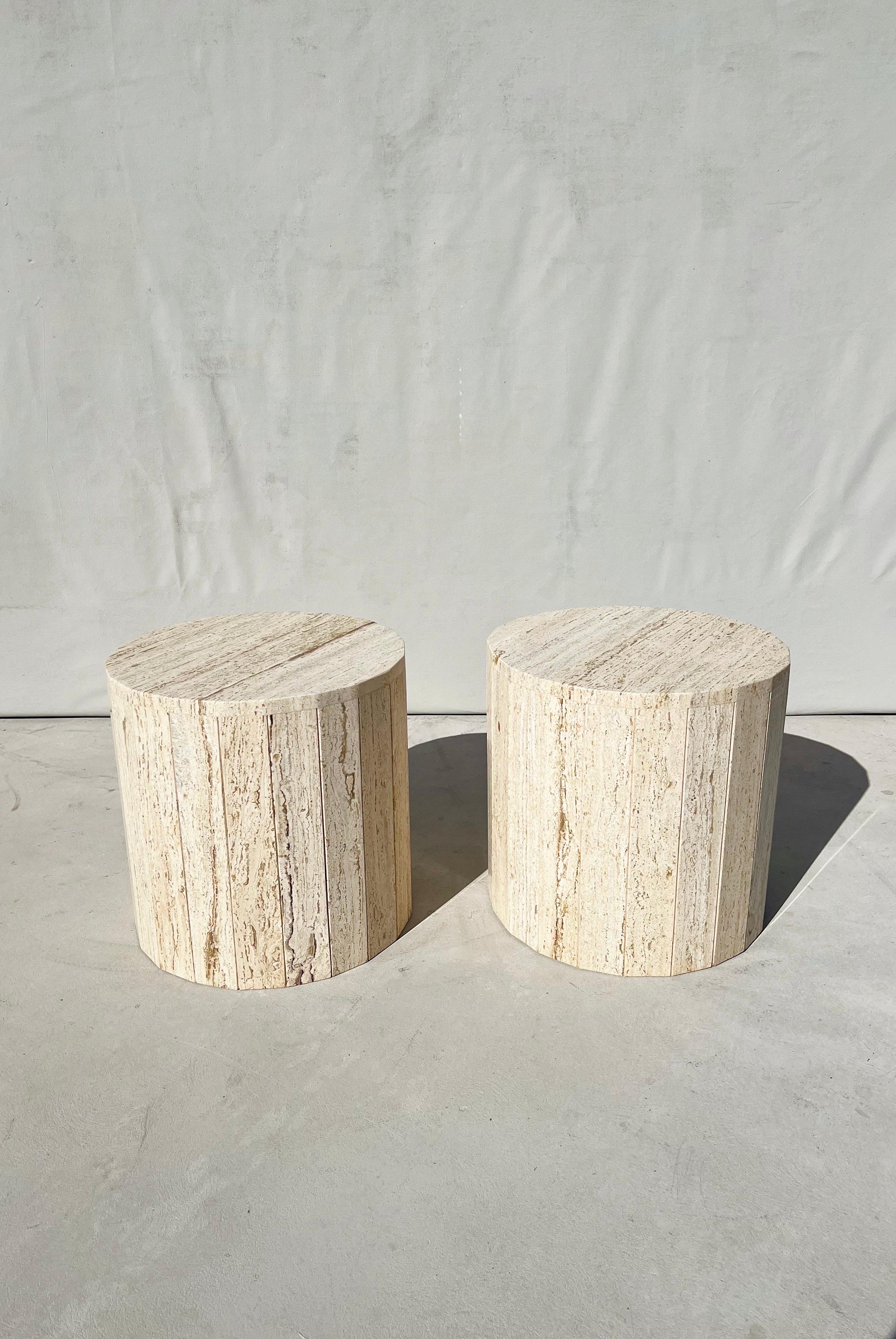Vintage pair of fluted italian travertine drum tables/ side tables /coffee tables /pedestals.

The perfect pair of travertine tables. Exhibiting an array of dreamy travertine colors such as creamy beige, eggshell, almond and striking accents of