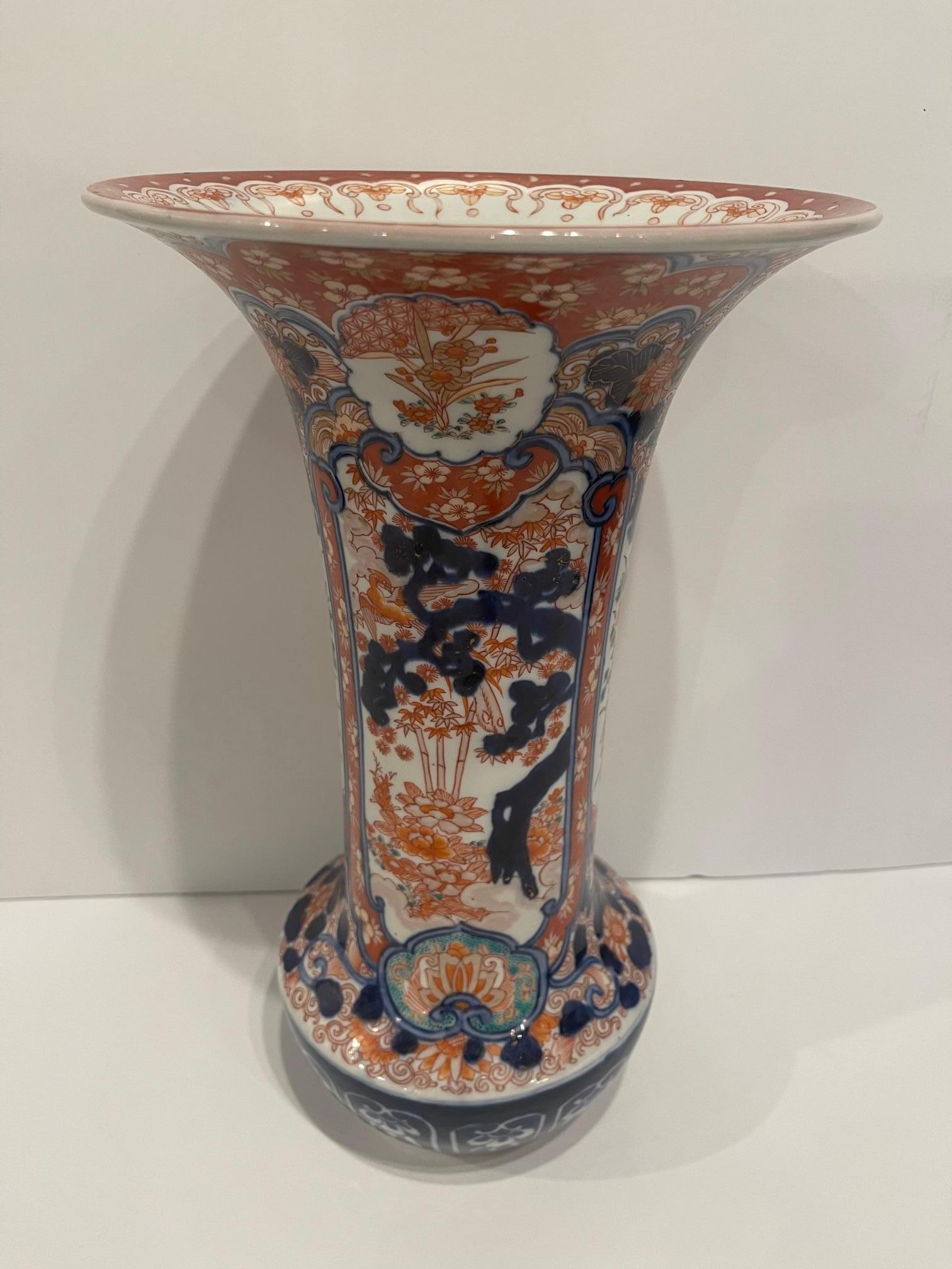Fluted Japanese Imari Vase, 19th Century.  Wood stand included.  Base is 4