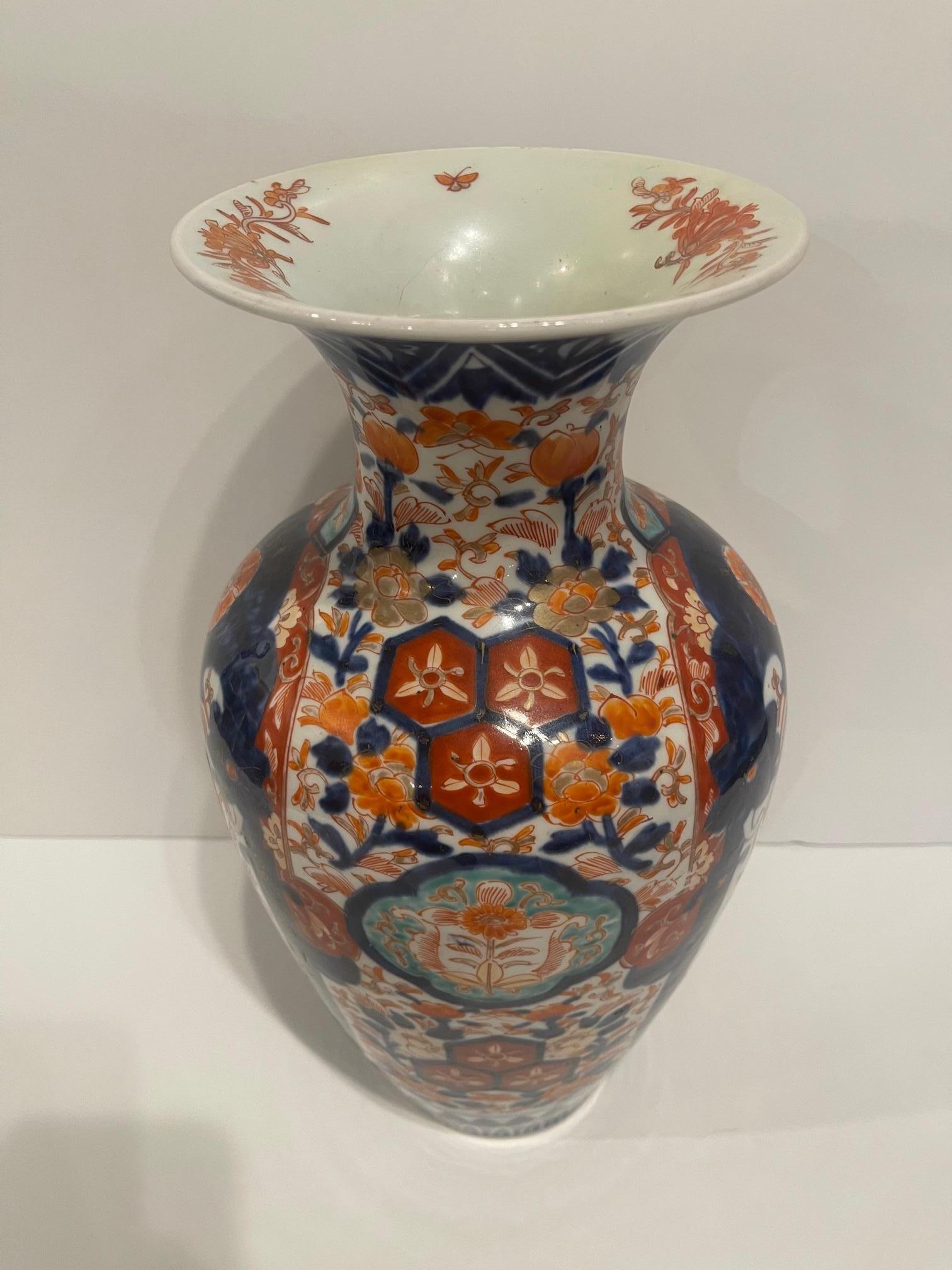 Fluted Japanese Imari Vase, 19th Century.  Wood stand included.  Base is 4.5