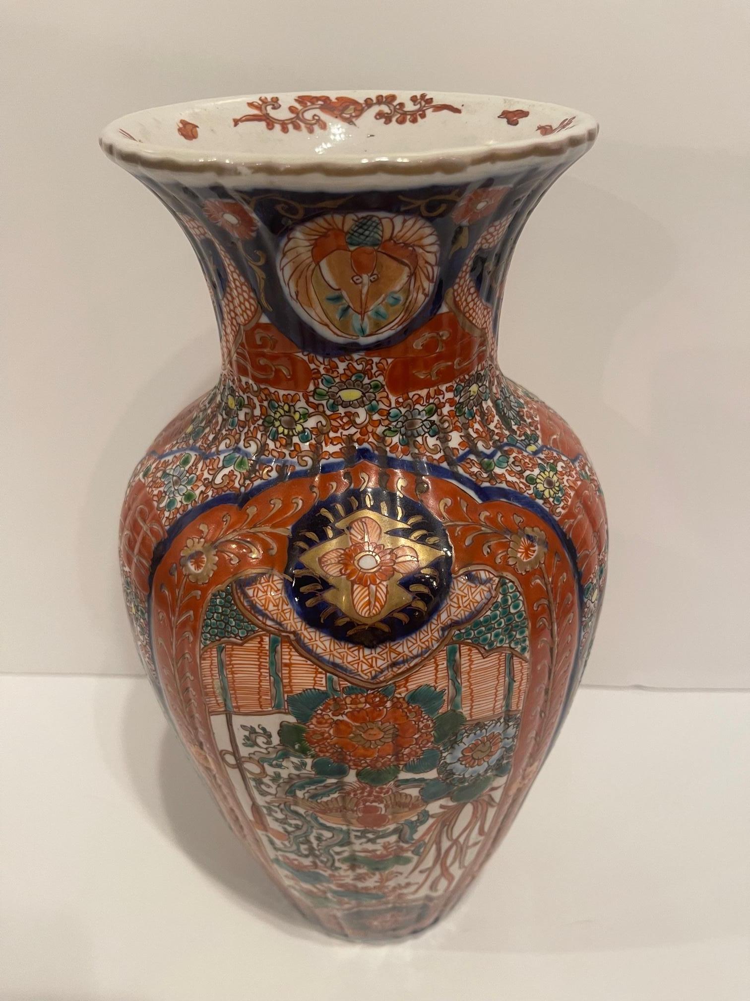Fluted Japanese Imari Vase, 19th Century.  Wood Stand is included.  Base is 4