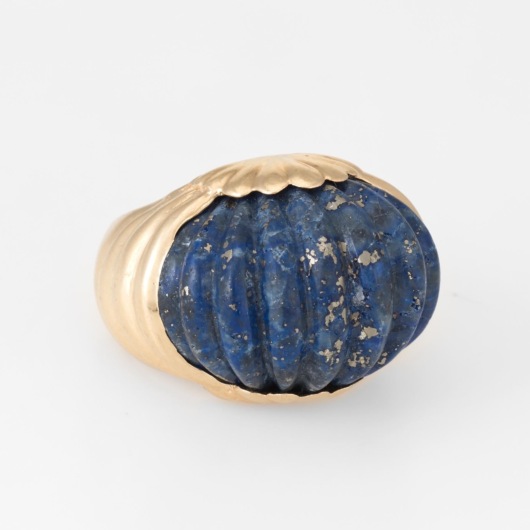 Finely detailed vintage cocktail ring (circa 1960s), crafted in 14 karat yellow gold. 

Fluted lapis lazuli measures 25mm x 15mm. The lapis is in excellent condition and free of cracks or chips.   

The ring is in excellent condition.