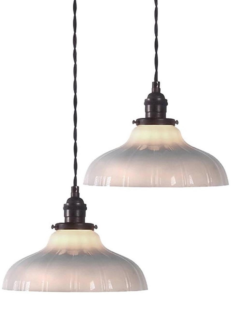 Softly curved bell shaped pendants are a Classic. They feel at home with any style decor. This example has a thick-thin pattern milk glass with a straight edge. The lamps are per lamp. This way you can buy just one or the collection. Measures: 9