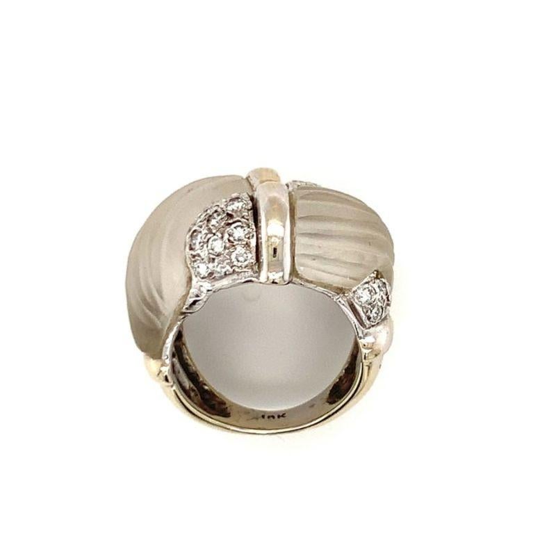 One fluted rock crystal quartz and diamond 18K white gold by-pass designed cocktail ring featuring two carved quartz portions seemingly intertwined with 20 round brilliant cut diamonds weighing approximately 0.60 ct.

Distinctive, harmonious,