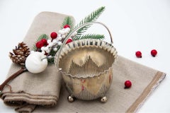 Fluted silver basket with wavy beaded edge, handle and four spherical feet