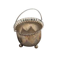 Fluted silver basket with wavy beaded edge, handle and four spherical feet