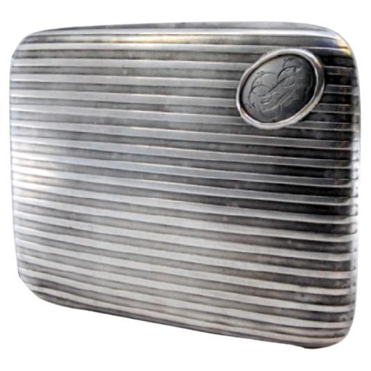 Description: Fluted silver cigarette case with monogram card and gold interior. Metal: Silver. Origin: Portuguese. Brand: javali II Title. Weight: 105.38 grams. Dimensions: 11x8cm. Content: 833/1000. Assay Mark: Yes, between 1887 and 1937.