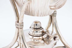Fluted silver kettle on trivet with lamp, four raised feet and wood-inset handle