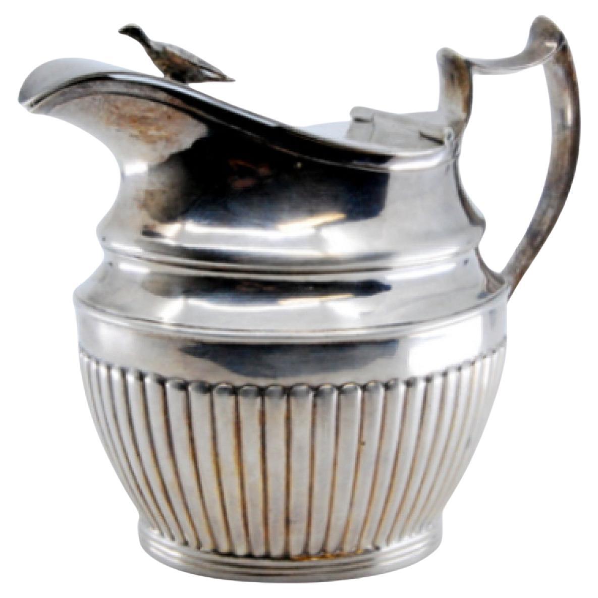 Fluted silver milk jug with half-body design and knobbed lid