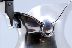 Fluted silver milk jug with wooden handle