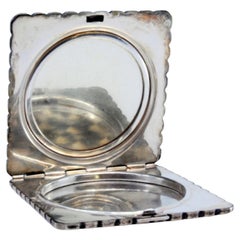 Fluted silver toiletry box with floral motifs and beading on the surround