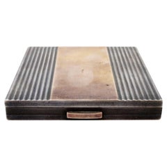 Fluted silver toiletry box with gold band, mirror and powder case