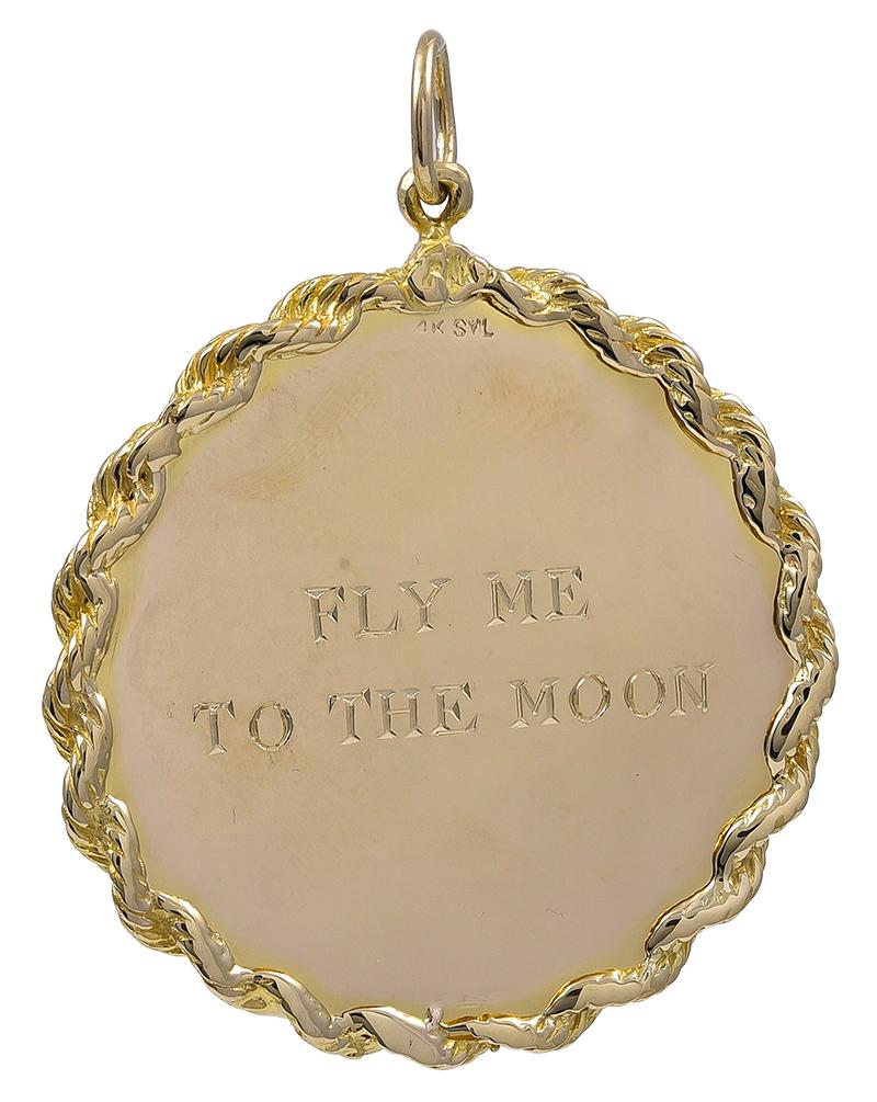 Large round charm.  Applied in the center: a jet plane, a moon and three stars.  Heavy gauge 14K yellow gold.  The background is a textured satin finish.  Applied rope border.  The moon and stars are encrusted with diamonds.  1 1/2