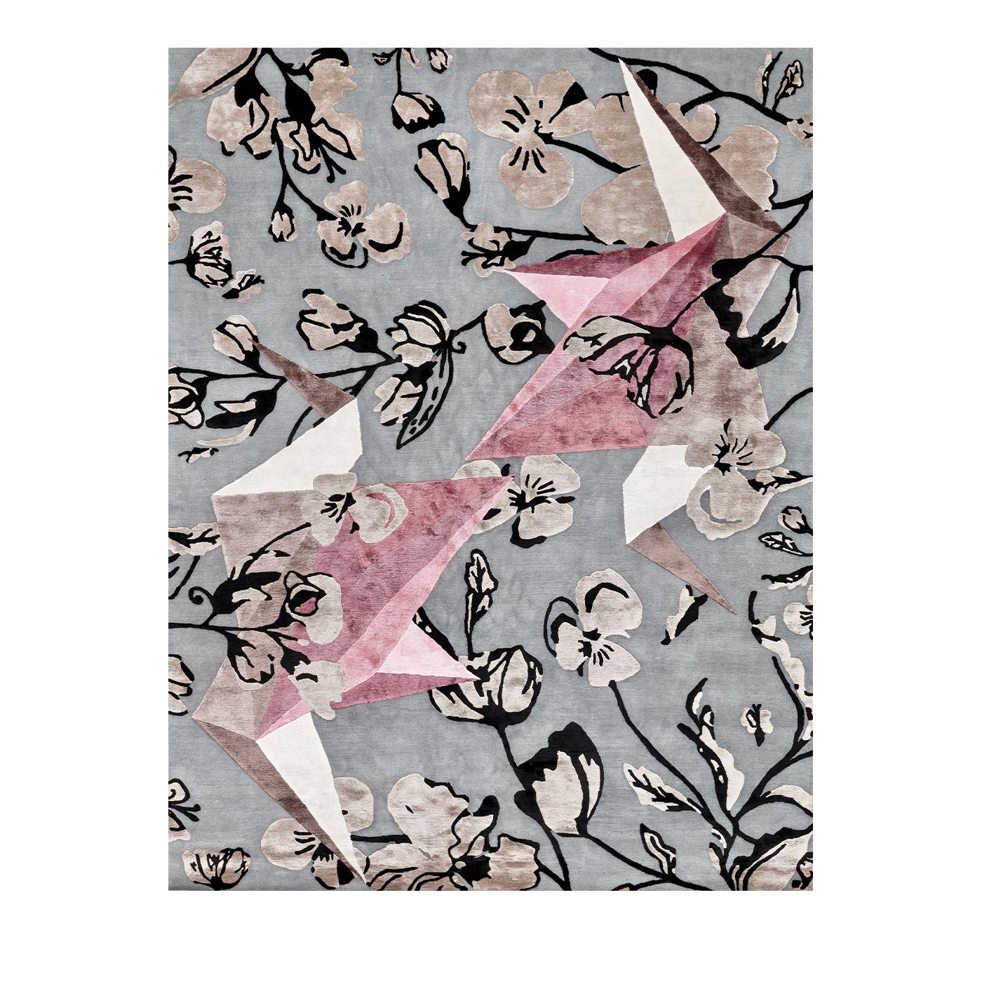 In this spectacular Flying Gru rug, two origami style cranes fly amongst Japanese flowers for a symbolic design of longevity, good luck and quality. Composed of 50% silk and 50% Himalayan wool, this delightful accessory will add flair and elegance