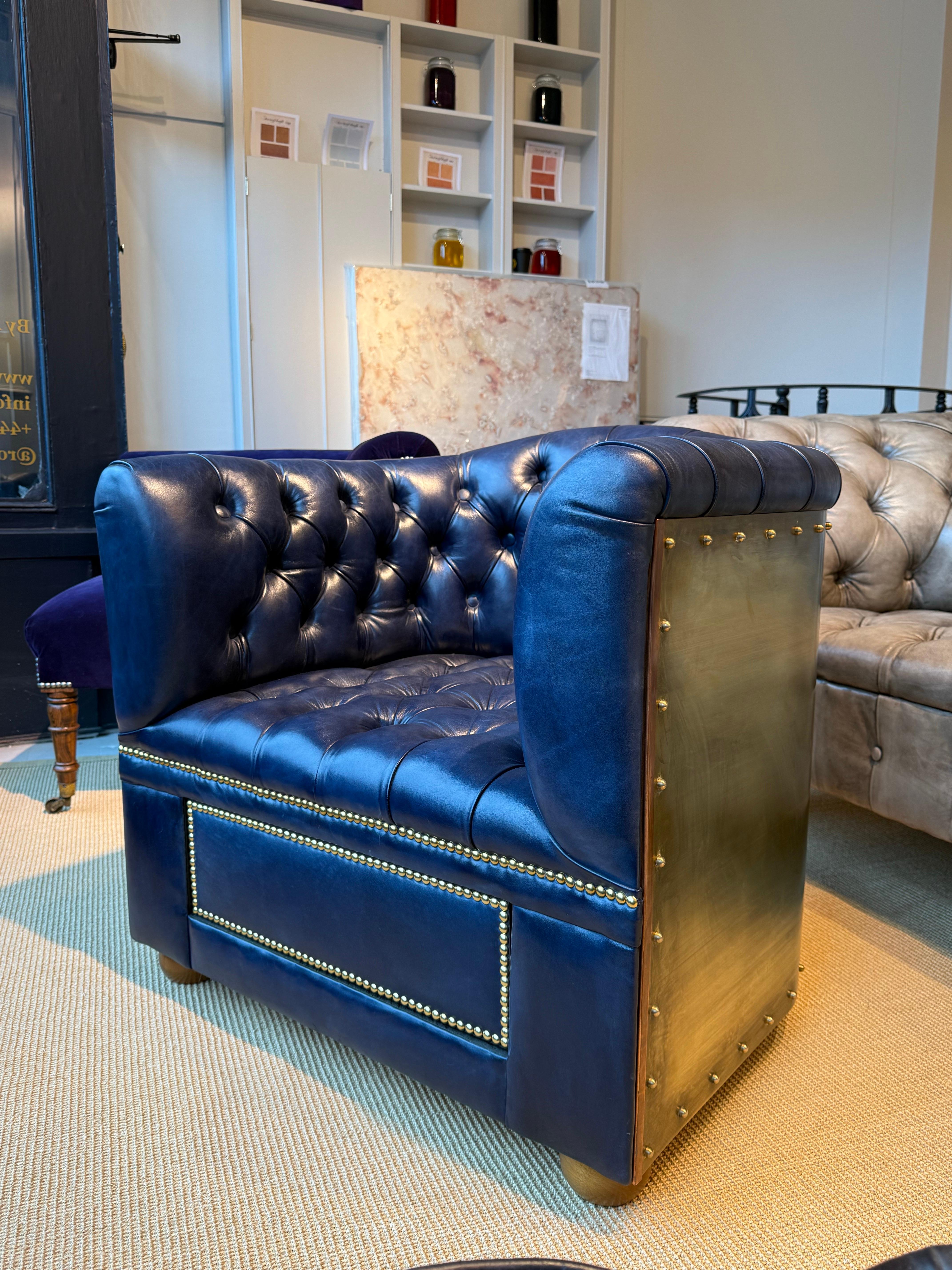 This is a fine exceptional example of our Flying Wing humidor chair.

Finished in our hand dyed Deep Ocean leathers and wrapped in solid brass.  

All complimented by one of our Spanish cedar fully humidified humidor draws with solid Macassar Ebony