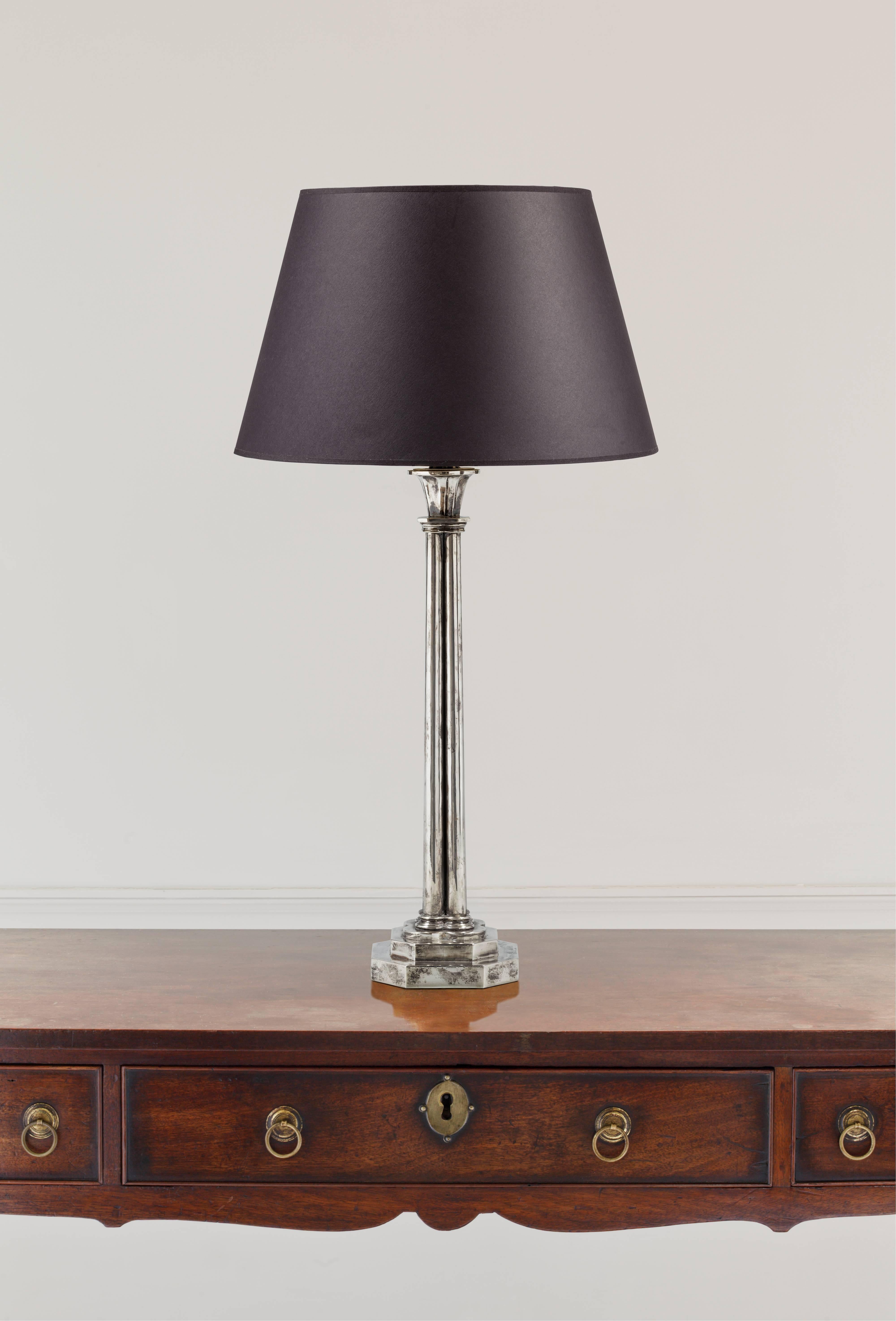 This architectural table lamp with a cluster column and stepped octagonal platform base is designed to work in both classic and contemporary interior.