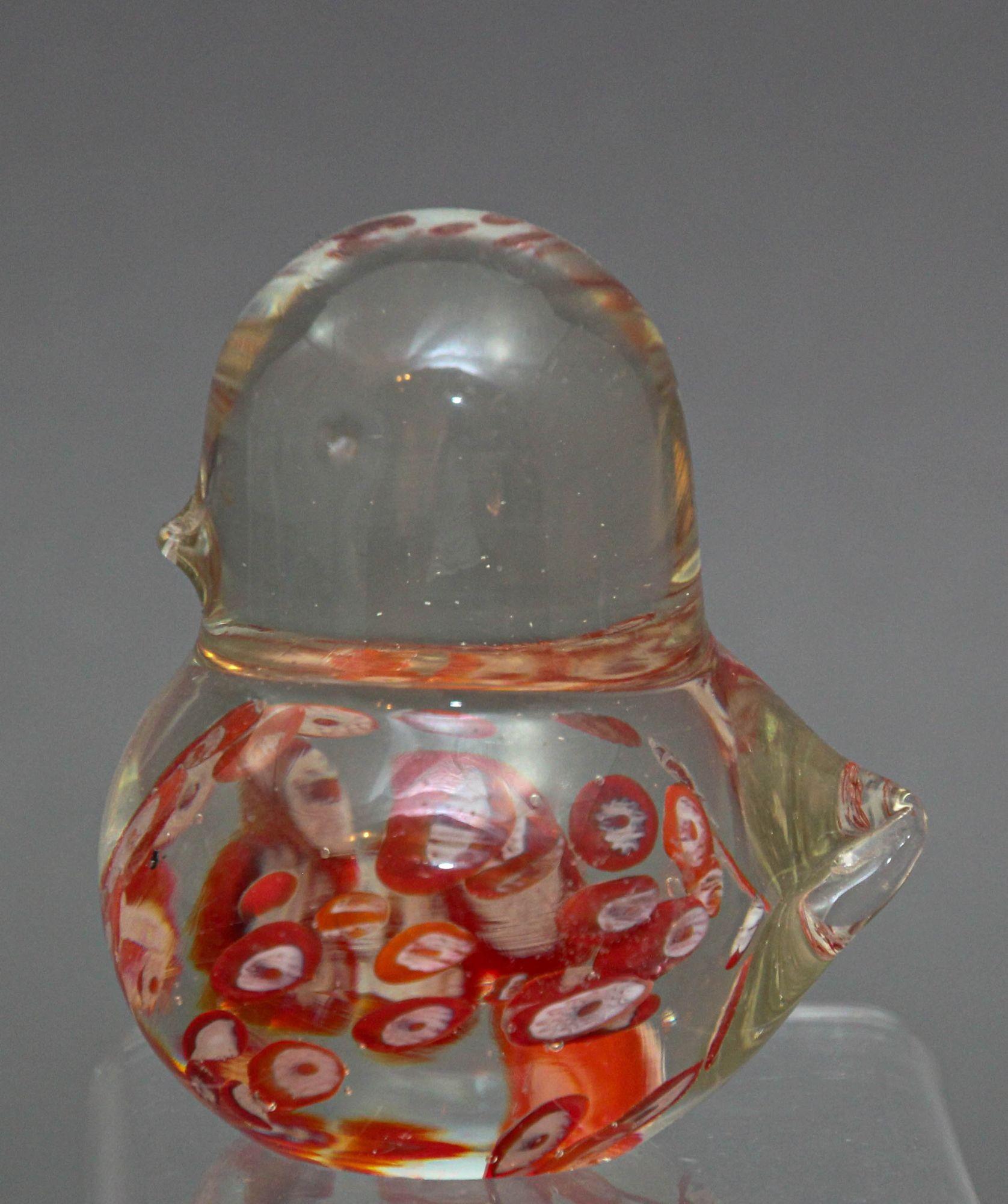 Scandinavian modern small crystal bird figure sculpture ornament attributed to Fare Marcolin for FM Konstglas Crystal Bird of Ronneby Sweden circa 1970s.
Vintage glass bird paperweight clear with red and white Millefiori Murano style.
Vintage