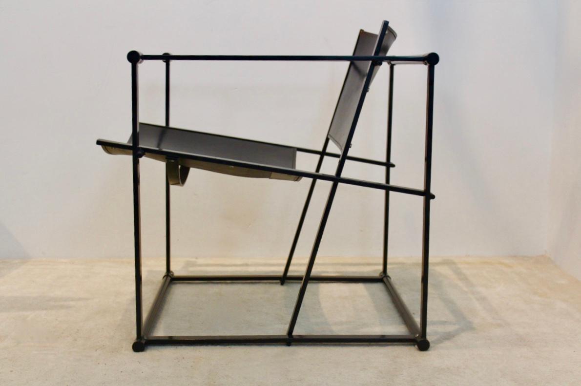 FM62 Cubic chair designed by Radboud Van Beekum for Pastoe the Netherlands in the 1980s. Lacquered square metal frame with the back and seat in strong black Saddle Leather with beautiful patina! Truly a unique piece with beautiful graphic