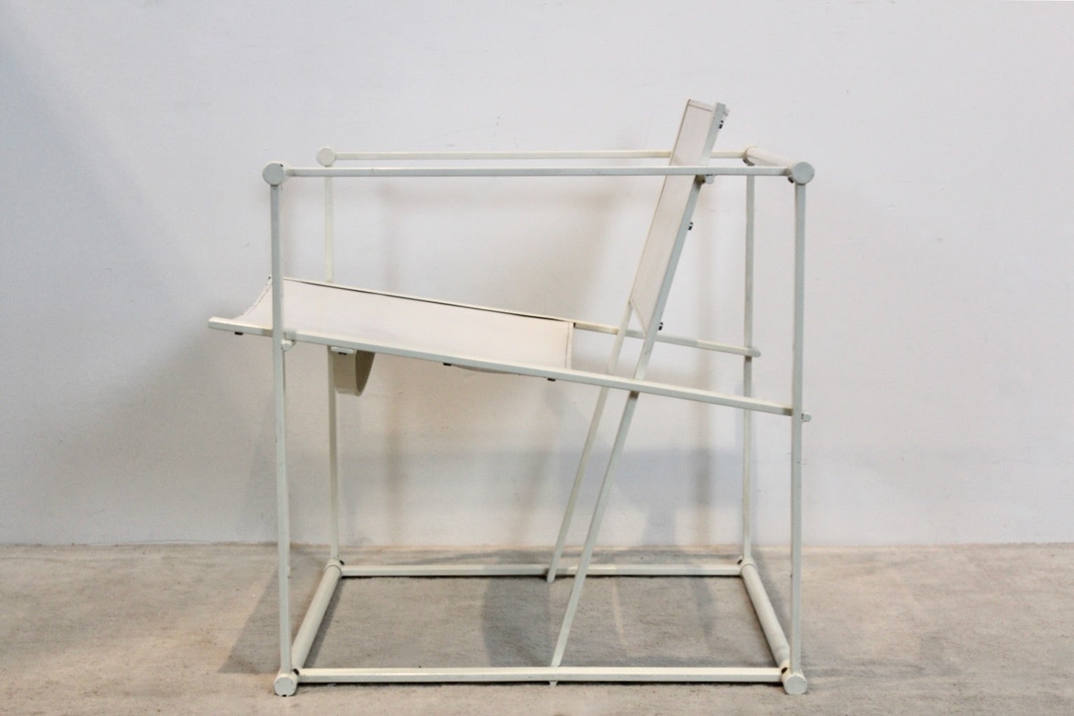 FM62 Cubic chair designed by Radboud van Beekum for Pastoe the Netherlands in the 1980s. Lacquered square metal frame with the back and seat in strong white Saddle Leather with beautiful patina! Truly a unique piece with beautiful graphic design.