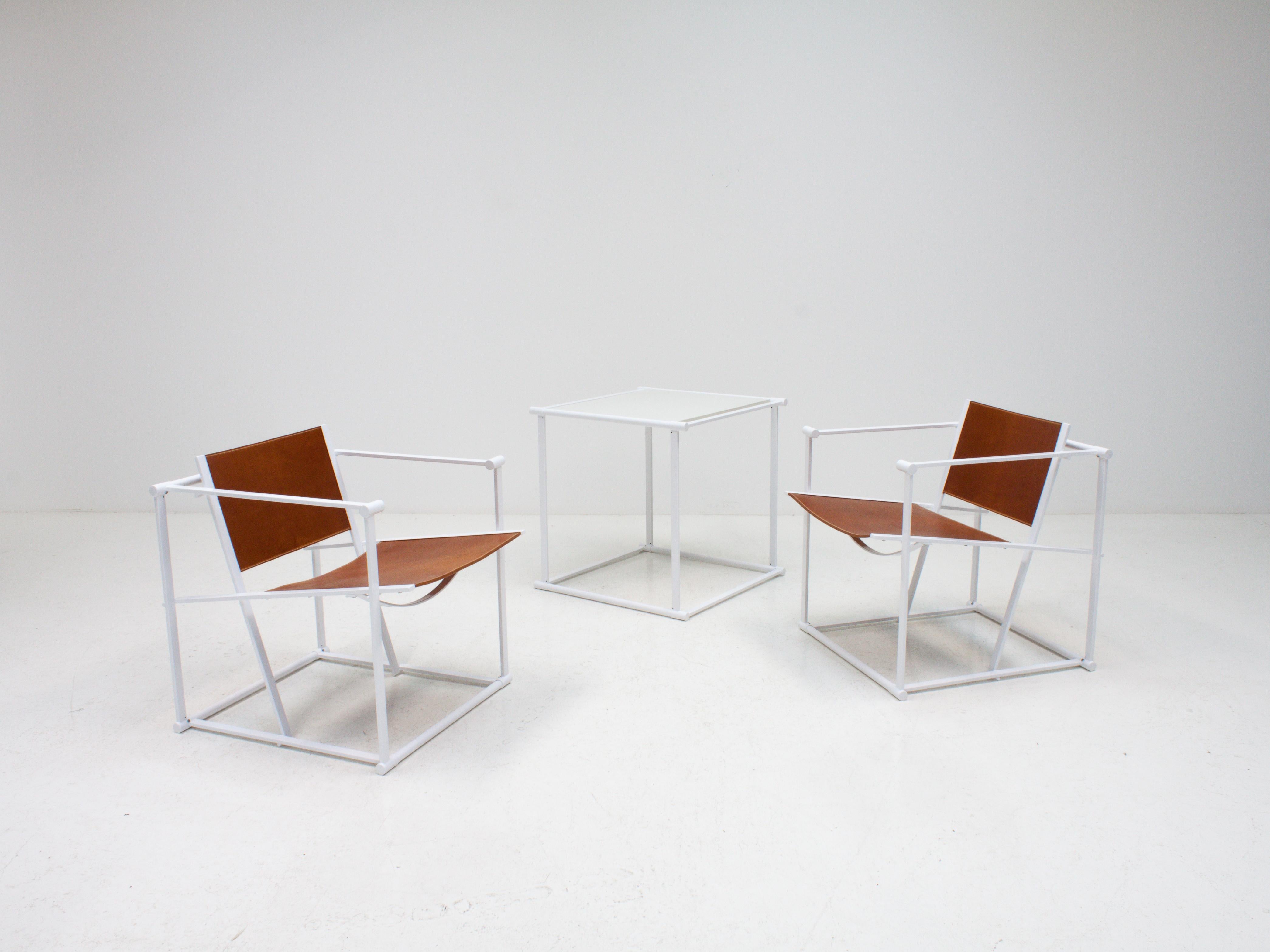 A pair of steel and leather FM62 chairs and table by Radboud Van Beekum for Pastoe, 1980s.

Constructed from geometrically folded steel with leather seating. Inspired by the designs of Gerrit Rietveld and following the traditions of the De Stijl