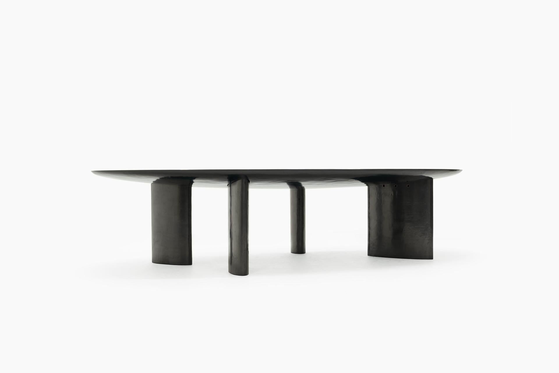 Uniq hand-applied graphite coating on the body and legs.
Hand-applied and polished layers of gun smoke and liquid aluminum on the top of the table.
Slight step on the outside edge of the top of the table.