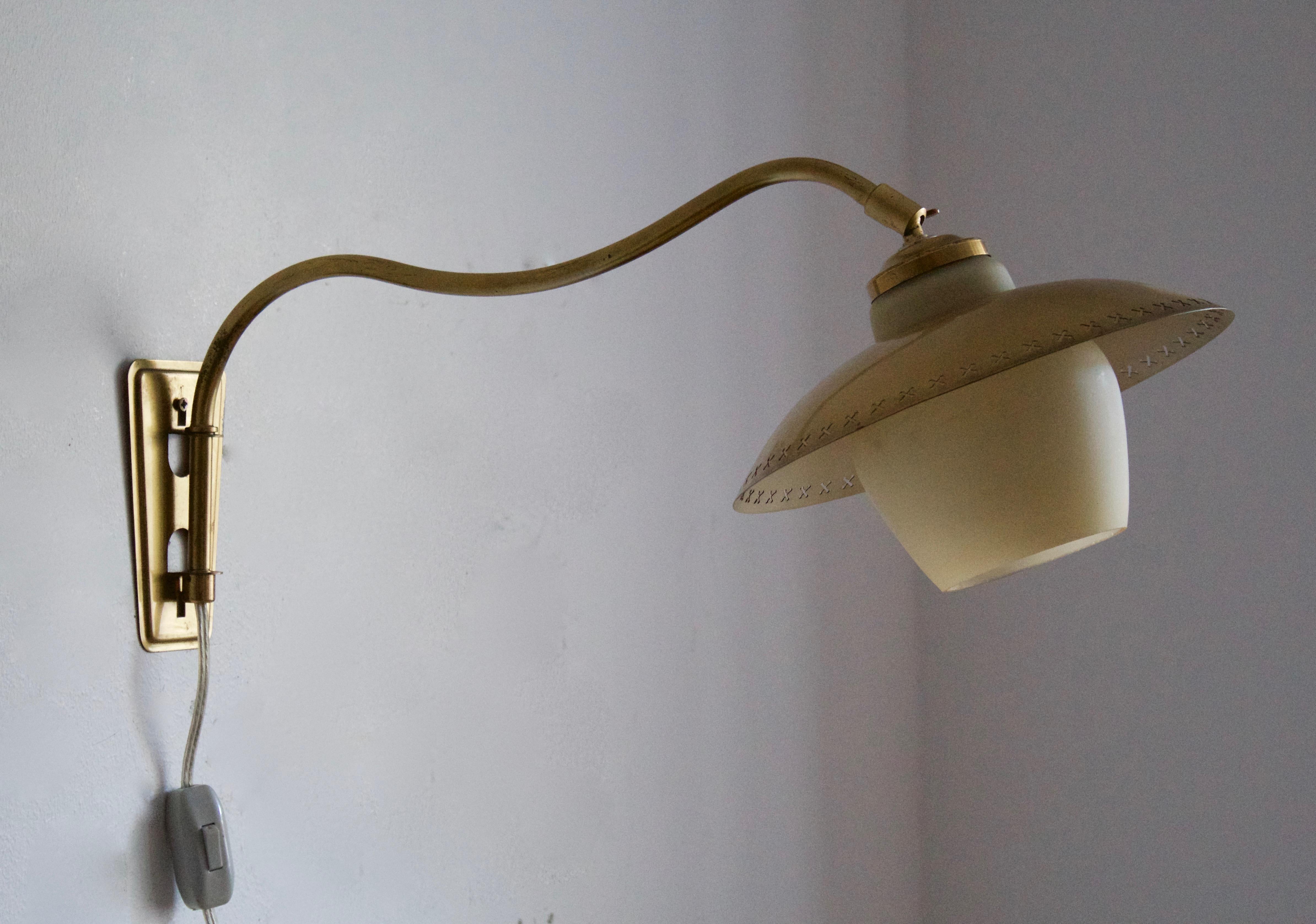 An adjustable wall light, designed and produced by Fog & Mørup, Denmark, 1950s.

Features brass and opaline glass.
    