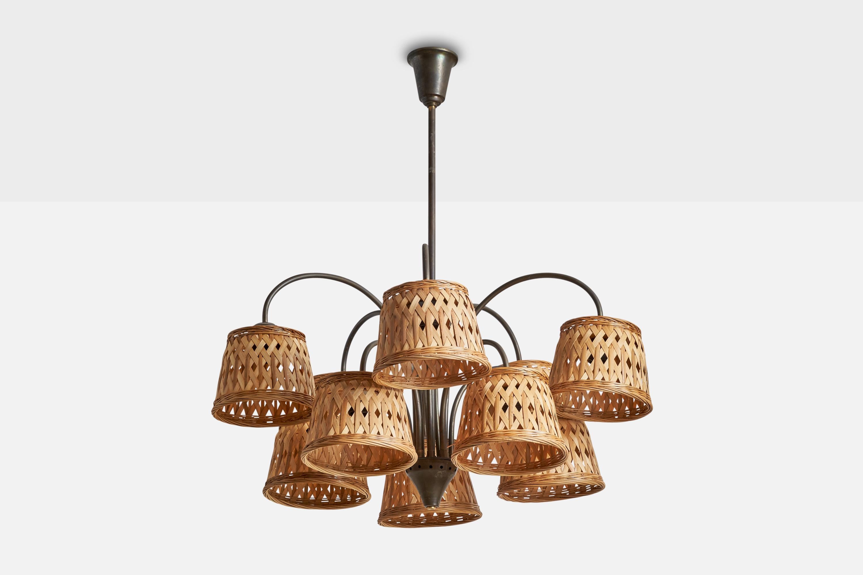 A brass and rattan chandelier designed and produced by Fog & Mørup, Denmark, 1940s.

Dimensions of canopy (inches): 3.5”  H x 3.5” Diameter
Socket takes standard E-26 bulbs. 10 sockets.There is no maximum wattage stated on the fixture. All lighting