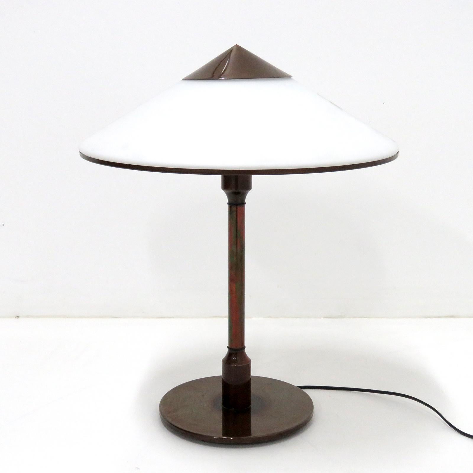 Elegant table lamp 'Kongelys' designed in 1937 by Niels Rasmussen Thykier for Fog & Mørup, bronze colored brass base and shade cap/trim with a white glass shade, individual on/off switch on the top of the stem, limited edition produced by Horn
