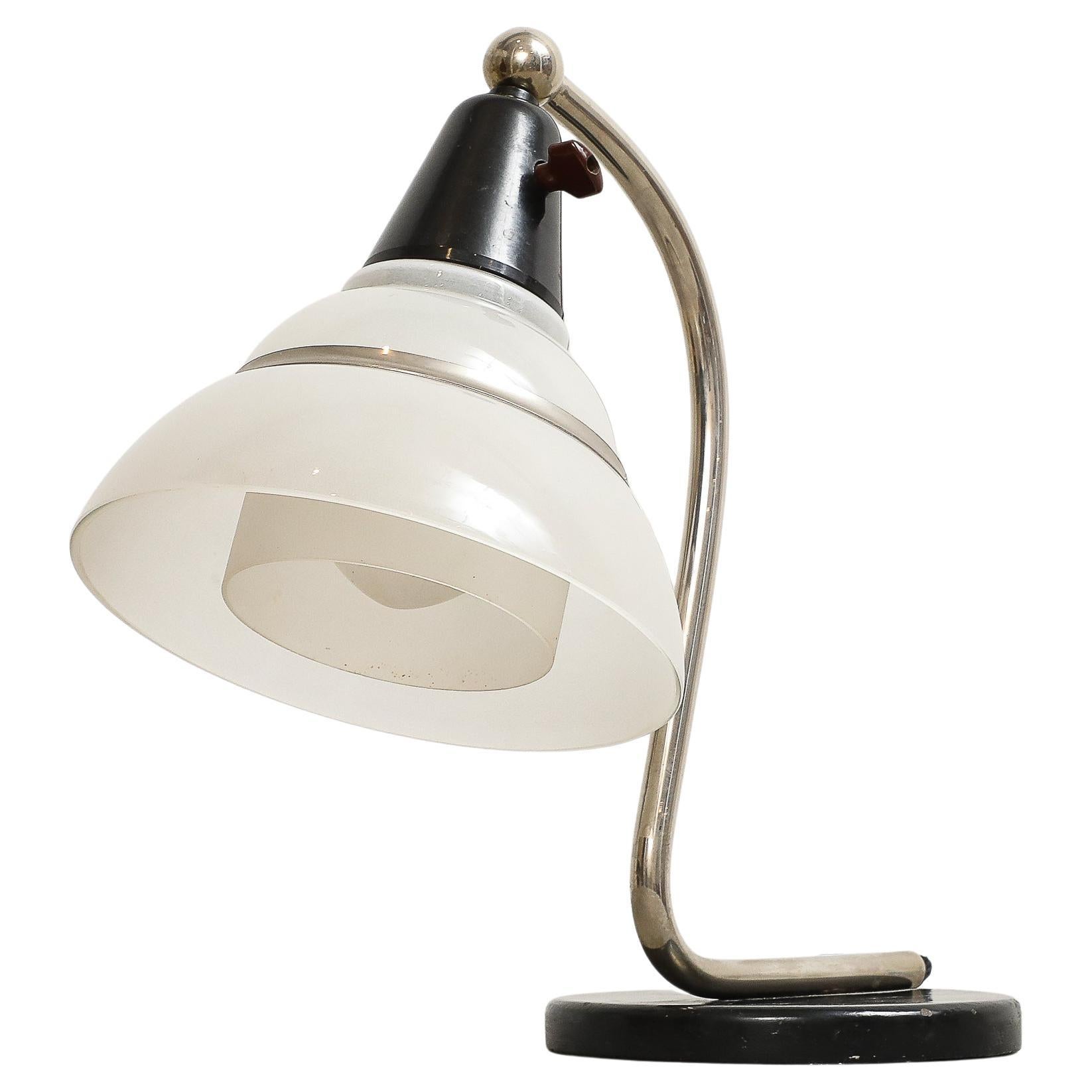 Fog & Mørup (Founded in 1815 in Copenhagen, Denmark by Ansgar Fog and E Mørup; eventually Lyfa-Fog & Mørup), snake table light, chrome with white frosted shades, origin: Denmark, circa 1930 - 1940.

All original.