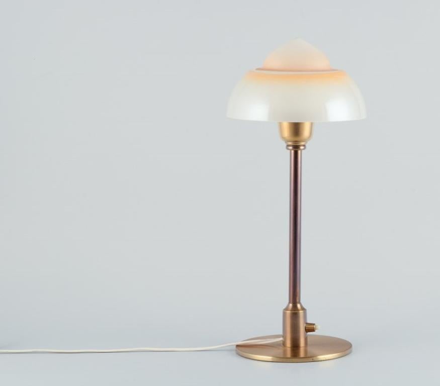 Fog & Mørup. Table lamp with a stem in patinated brass, fitted with a 