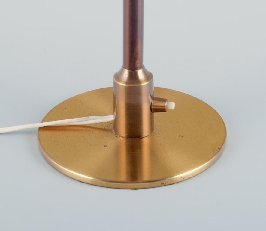 Scandinavian Modern Fog & Mørup. Table lamp with stem in patinated brass and 'Fried Egg' glass shade