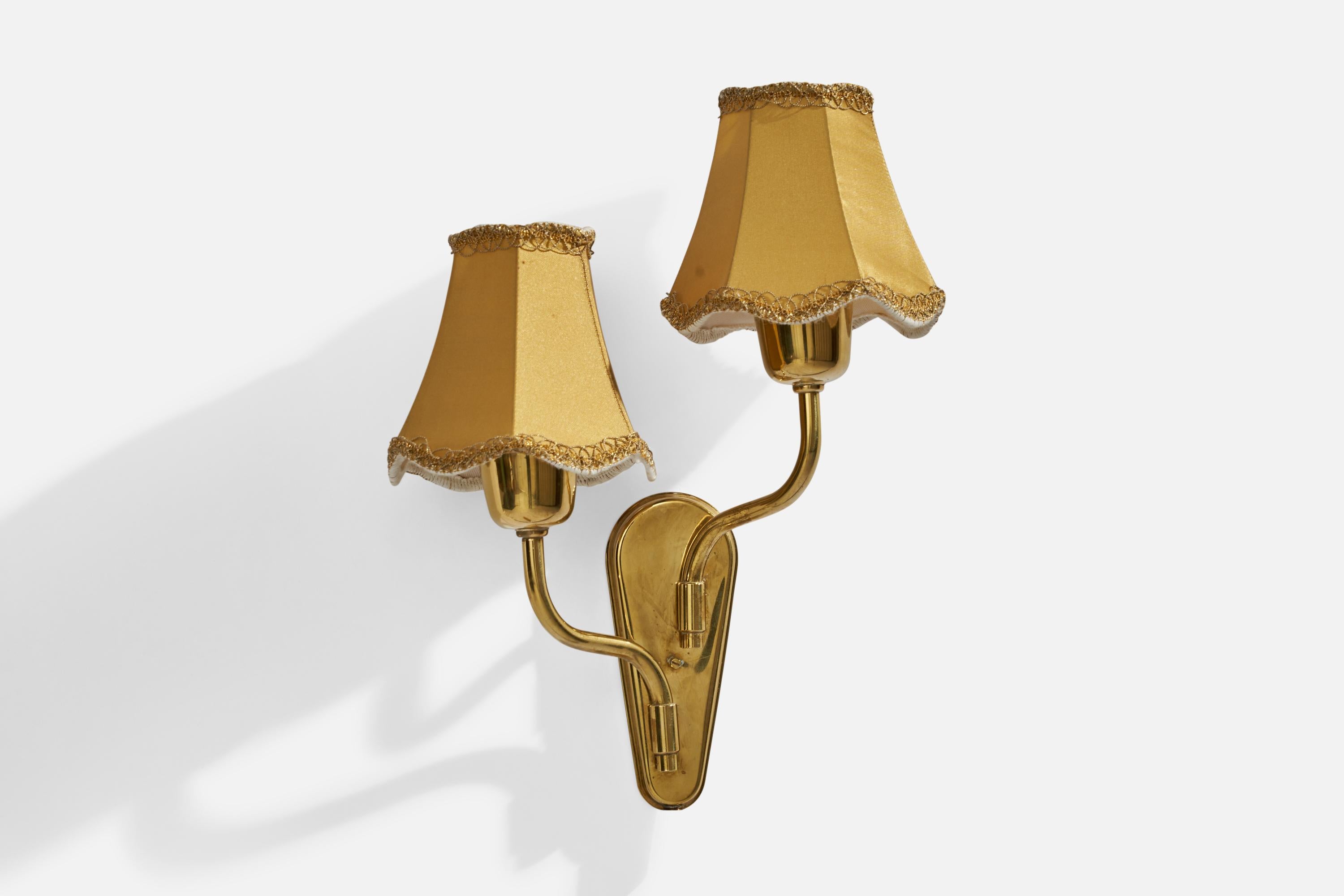 A brass and fabric wall light designed and produced by Fog & Mørup, Denmark, c. 1950s. 

Overall Dimensions (inches): 13.5”  H x 9” W x 5.25”  D
Back Plate Dimensions (inches): 6” H x 2.25”  W x .75”  D
Bulb Specifications: E-14 Bulb
Number of