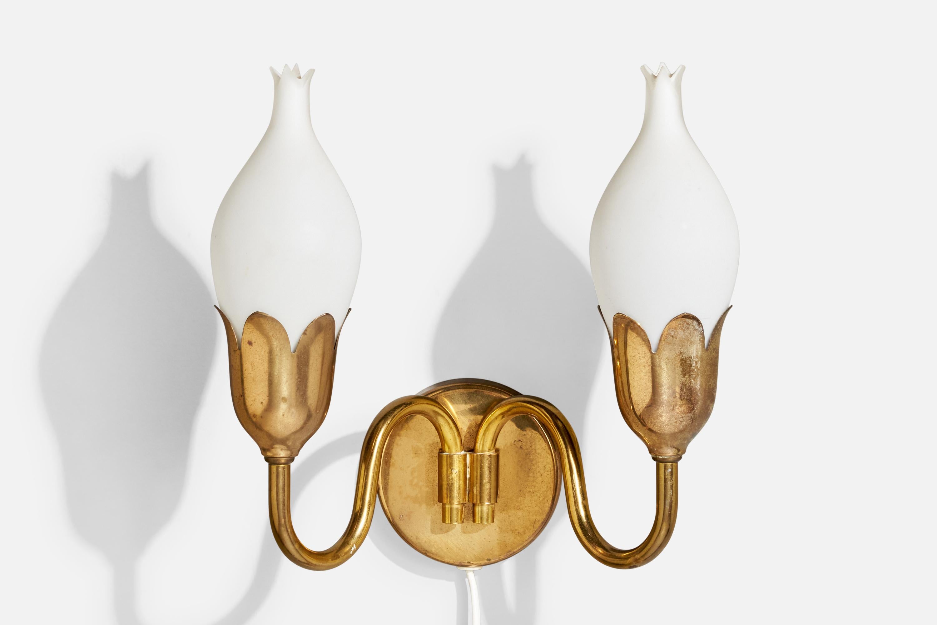 A brass and white opaline glass wall light produced by Fog & Mørup, Denmark, c. 1950s.

The brass fixture presents with light to moderate oxidation throughout.

Overall Dimensions (Inches): 9.25” H x 9.375” W x 5.5“ D

Back Plate Dimensions