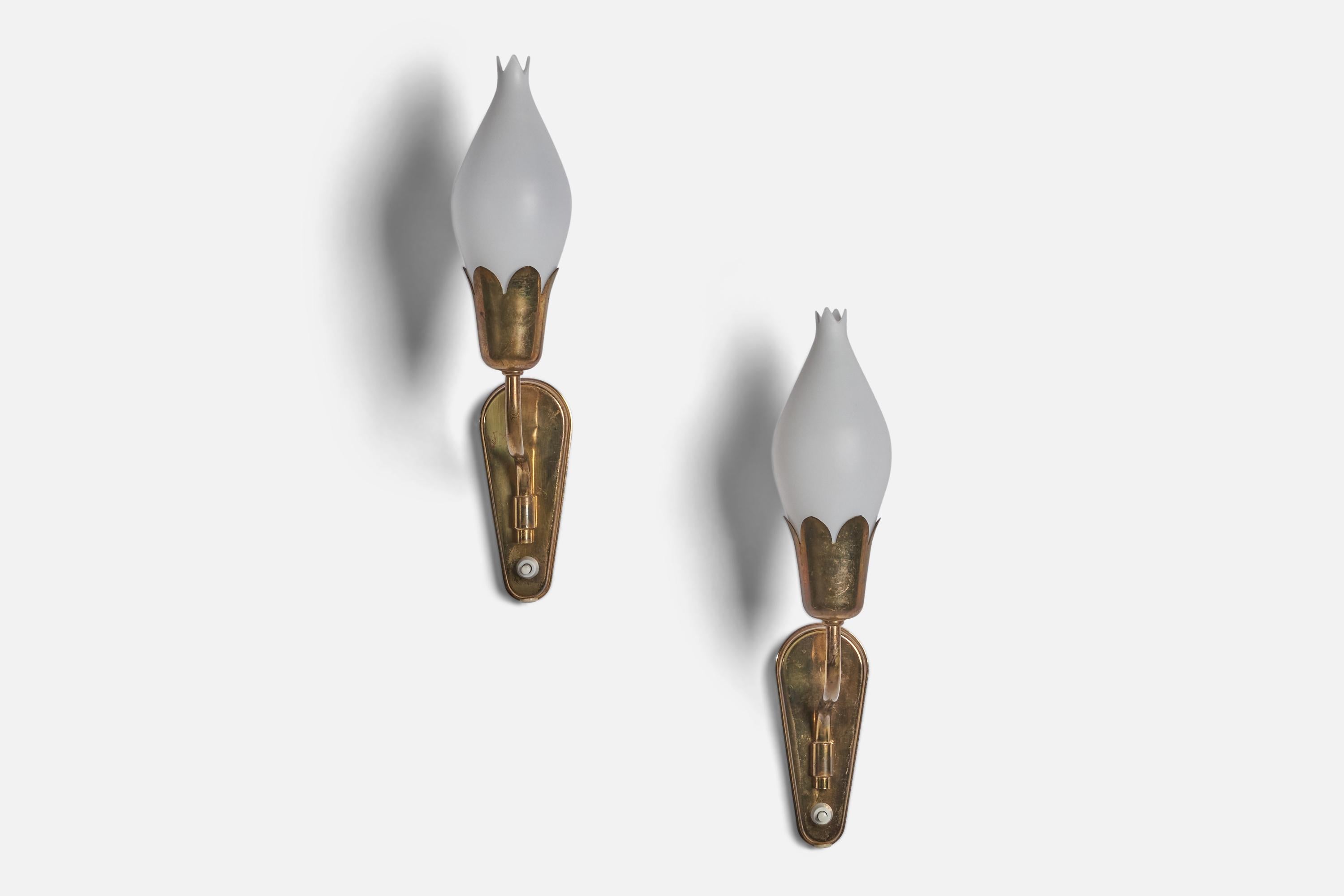 A pair of brass and opaline glass wall lights designed and produced in Denmark, 1950s.

Overall Dimensions (inches): 14.5” H x 3” W x 5.5” D 
Back Plate Dimensions (inches): 6” H x 2.5” W x 0.6” D
Bulb Specifications: E-14 Bulb
Number of Sockets: