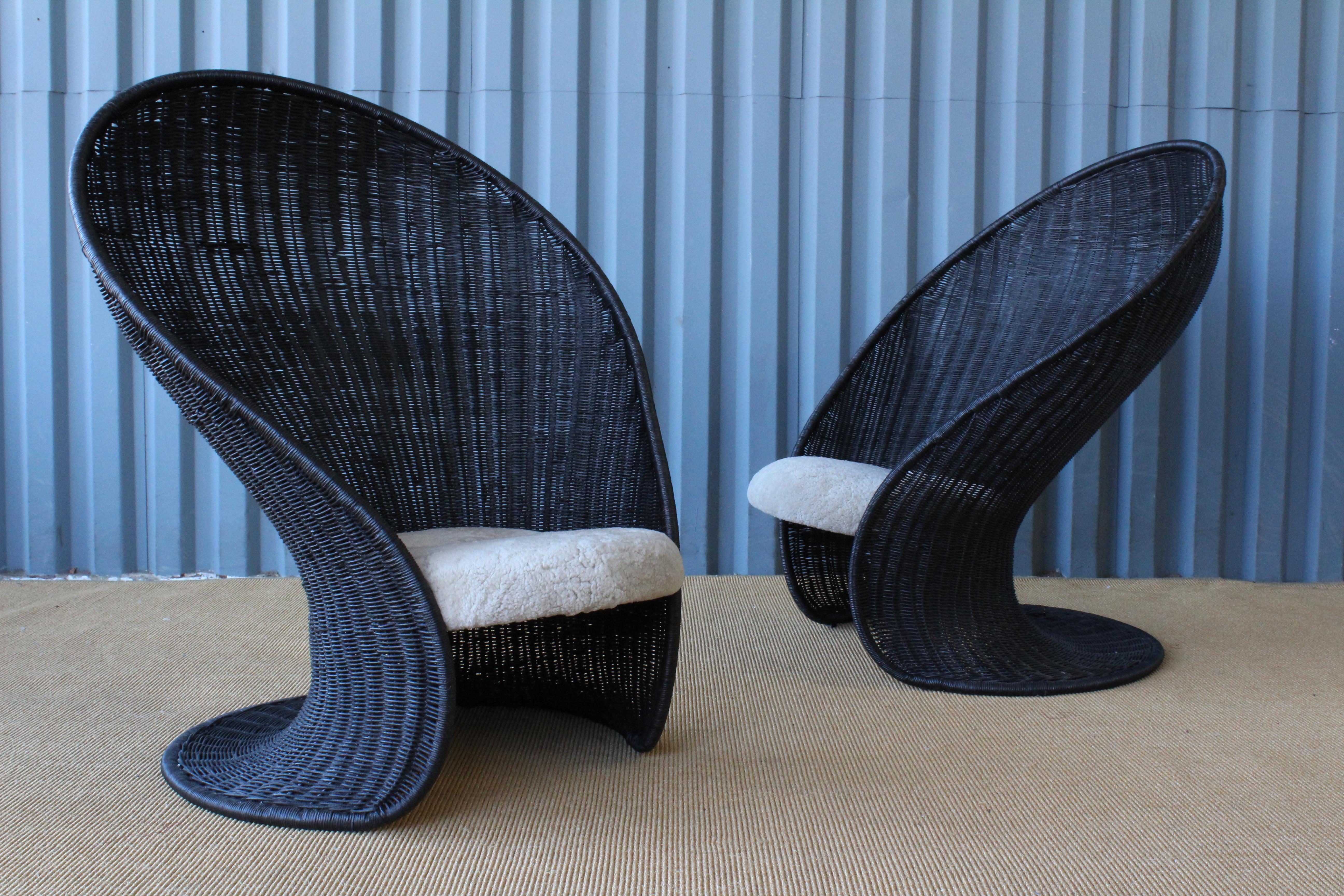 Mid-century wicker 'Foglia' chair by Giovanni Travasa for Bonacina, Italy, 1965. Pair available, sold individually. We've had these chairs completely redone and recovered in an off white shearling. Wicker finish is in a dark brown, almost black.