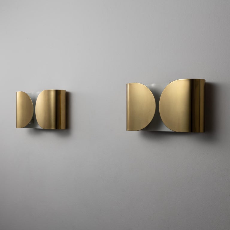Pair of “Foglio” sconces by Tobia Scarpa for Flos. Designed and manufactured in Italy, 1967. Rewired for U.S. standards. We recommend: two E27 Sockets 75w maximum bulb per fixture. Lightbulbs not included. Priced and sold as a pair.